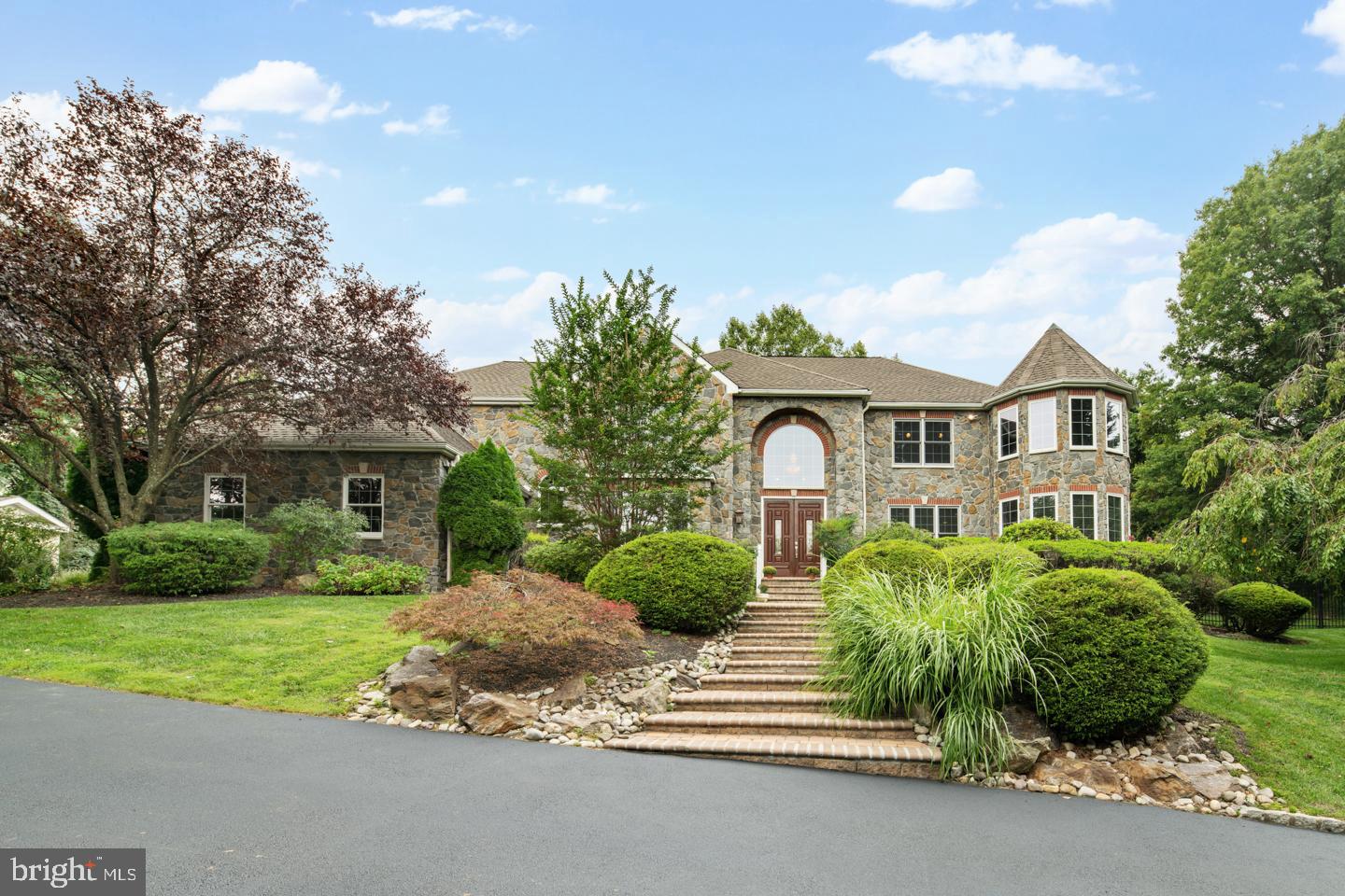 MATTERPORT 3D VIRTUAL HOME TOUR LINK: https://my.matterport.com/show/?m=4rQXL6BfUhY&mls=1 Exceptional quality construction abounds at this newly renovated custom 6 bed 3 full and 2 half baths Main Line jewel tucked away in coveted Penn Valley and situated on a quiet, private cul-de-sac reminiscent of a Normal Rockwell painting. Going up a newly installed driveway you are greeted with a 3-car garage and basketball court. Set on 1.20 lush, manicured acres, the estate's rear property sits above all the homes on the street, so your views are protected and you experience complete privacy. Views of the city from the 2nd floor archway. Beautiful nature vistas enjoyed from every vantage point and are enhanced by the quality construction and materials. Refined details add to the allure, such as EP Henry walkways & locally sourced gray mica schist stone exterior. Main Level is an open design with 18 ft cathedral ceilings, double entrance doors, solid premium oak flooring throughout the first floor including the family room, kitchen, dining room, and grand entrance. Gas fireplaces in the living room provide a warm place to relax with friends and loved ones. When entertaining guests, these generous rooms along with an elegant extra-long formal dining room afford a perfect flow, complemented by a butler’s pantry. The richly appointed kitchen with a spacious breakfast room comes well-equipped with professional stainless steel appliances and custom wood cabinetry. Right off the kitchen sits the entrance to the rear yard, with a brand new open faced deck, leading to the immaculately designed landscaping and terraced seating area. In this private oasis sits huge back and side yards, with multiple ideal locations for a pool. 2nd floor boasts a huge master bedroom situated on the east wing of the house with trey ceiling and circular sitting room with 270 degree views. His and hers walk-in closets and a master bath adorned in imported Italian marble, with oversized shower and dual shower heads, 2 person Jacuzzi and separate water closet. 4 additional bedrooms are situated in the west wing, 2 sharing Jack and Jill bathroom each with separate vanities, along with one bedroom with a private bath. Each of these bedrooms are light filled and come outfitted with custom California closets. Additional suite on the 3rd floor featuring 2 large skylights is perfect as an in-law or au-pair suite. Basement has been finished boasting 2 very large rooms. Perfect for home theater, pool table or additional home office. The possibilities are endless. 2 minute drive to i-76, with Center city being 15 minutes away, easy access to route 23, and loads of shopping to be done in a 10 minute area surrounding the home.