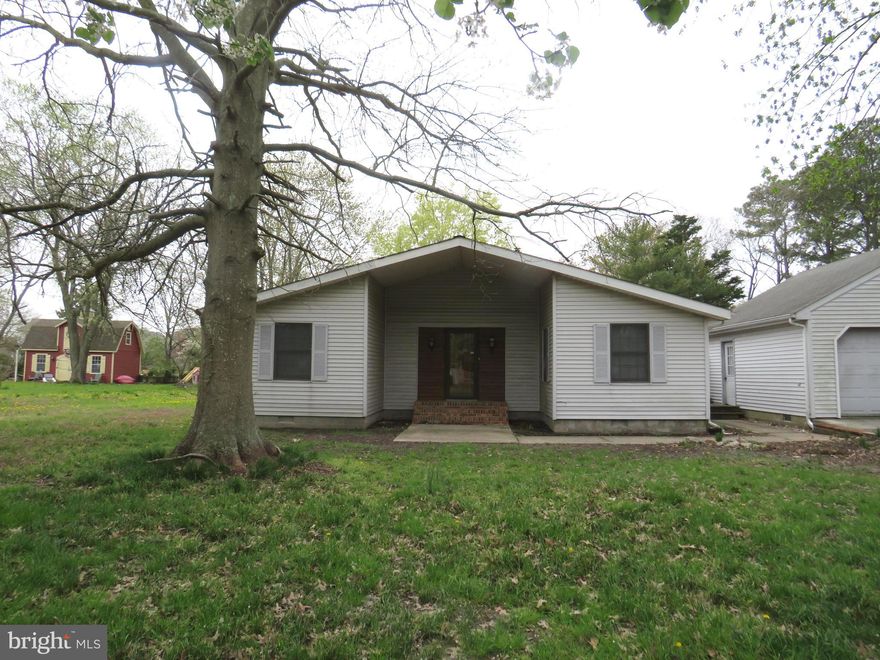 Great location, great bones to work with in this contemporary mid century home.  Slate entry, sunken living room and family room with vaulted beamed ceilings, TWO brick fireplaces, one with propane insert, the other with a pellet stove.  Large kitchen, formal dining room, three bedrooms, two baths. Detached two car garage in good condition.  House  needs some updating to make it a truly great home!  Pool and deck area need to be removed, outbuildings are in very poor condition, need removal.  Property is sold "AS IS", seller will not do any repairs. Inspections are for buyer information only.  Propane space heaters, electric baseboard units and central air.  Bring your imagination for renovation!  Will not qualify for FHA or VA.