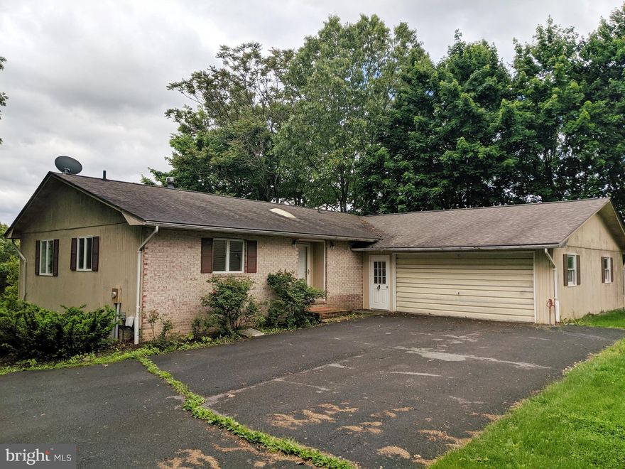 Come and take a look at your new Rancher. Open floor plan for easy entertaining.  Grill on your deck over looking a small pond. Great location close to the main gate. Fresh paint.