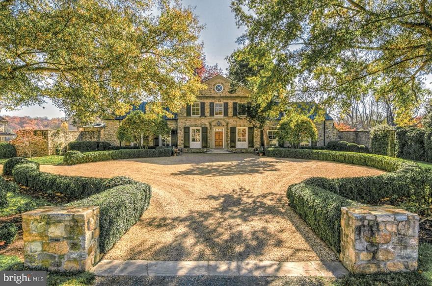 Oakendale Farm, a prestigious 435-acre estate dating to 1938, represents the pinnacle of equestrian living. Designed by celebrated architect William Lawrence Bottomley and crafted by master builder W.J. Hanback, this Colonial Revival stone manor commands breathtaking vistas from the Bull Run to the Blue Ridge Mountains. The estate's gracious interiors feature wide-board walnut flooring, a curved staircase, and elegant formal spaces including a banquet-sized dining room and handsome paneled library. Multiple courtyards connect the manor to additional structures including a private office, guest house, and a custom greenhouse. The grounds showcase meticulously manicured gardens, a 60-foot pool with pool house, and extensive equestrian facilities. Protected by the Virginia Outdoors Foundation across two parcels, Oakendale Farm offers unparalleled opportunities for countryside pursuits and distinguished entertaining.