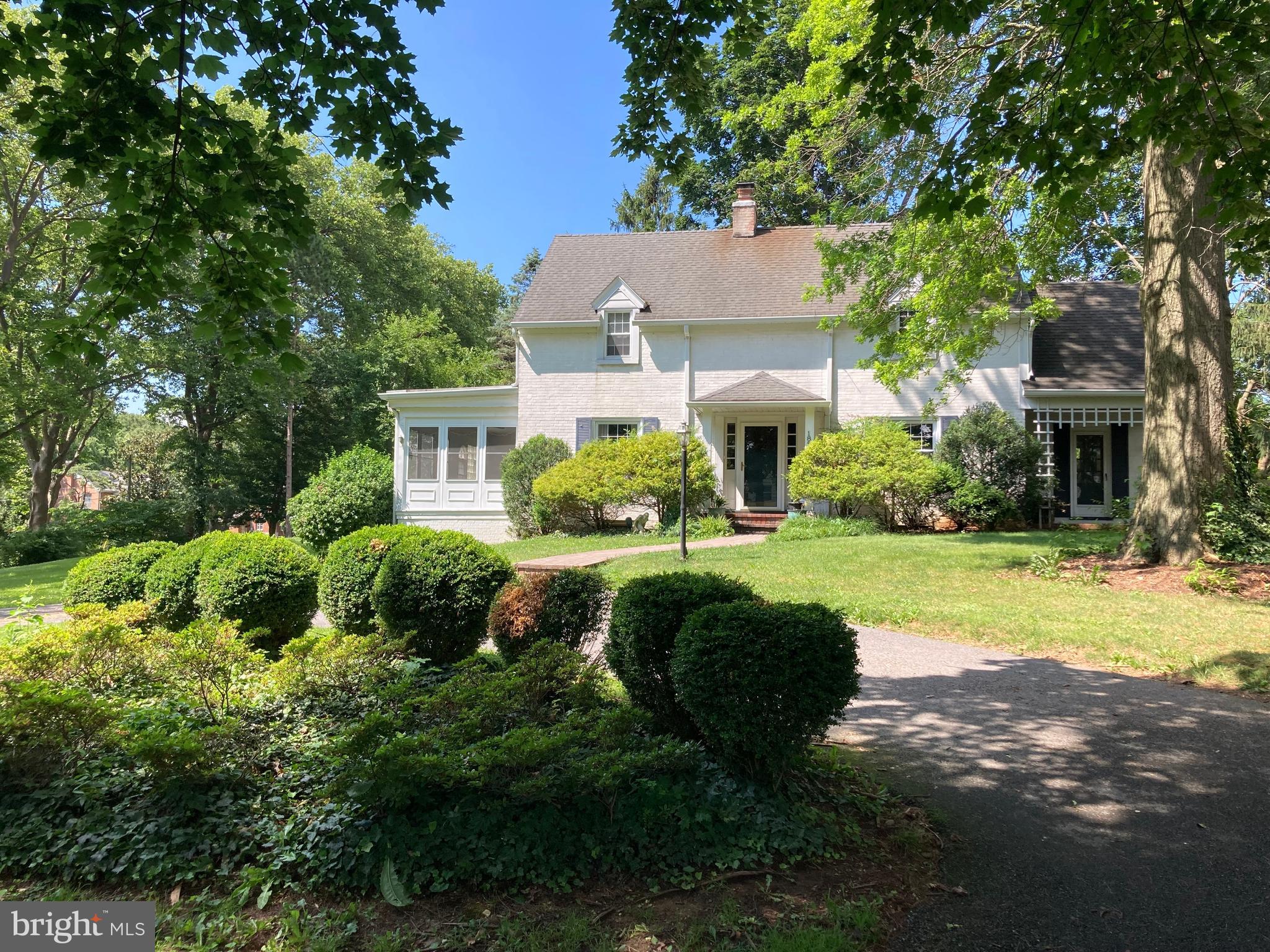 Beautiful setting! Stately. Spacious. Charming. This colonial home on a corner lot is located in the highly sought after Fountain Head neighborhood. Upon entering, the main level includes so many options to spread out: a formal living room with wood burning fireplace, a formal dining room, a large family room with skylights, an office, a library and a 3-season room. And the eat-in kitchen??!! Wow! This is a chef's dream kitchen with plenty of counter space, loads (and loads!) of cabinets, 2 dishwashers and a butler's pantry (which still houses period cabinetry and glass door knobs). The wood staircase takes you upstairs to 4 bedrooms, including 2 (!) en-suites, a 3rd full bathroom and a cedar linen closet. The lowest level includes the laundry, a finished portion that could be used how you'd like (game room? media room?) and includes the 2nd wood burning fireplace in the home. Outside, the private fenced and well shaded backyard, and 2-tiered brick patio can be accessed from the family room or kitchen area and will offer lots of entertaining options. The double garage and wide driveway are on the side of the house, and a front circular driveway provides plenty of parking for guests. Enjoy evening walks along the golf course just footsteps away! Truly a wonderful home!!