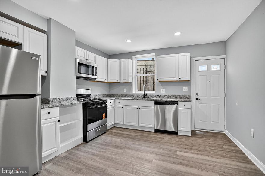 Welcome to your newly renovated townhouse, a blend of modern design and comfort, just steps from the historic and vibrant Patterson Park. This 2-bedroom, 2-bathroom home offers the perfect city living experience with a fresh, contemporary feel.
Step Inside and Discover a Spacious Layout
The main level features a bright and inviting open floor plan. You'll find sleek, wood-look flooring and a clean, neutral color palette throughout. The kitchen is a true standout with its white shaker-style cabinets, stainless steel appliances, and gleaming granite countertops. It’s an ideal space for daily cooking and entertaining, seamlessly flowing into the main living area.
Head upstairs to find two spacious bedrooms, including a master suite with a private, full bathroom. Both upstairs bathrooms have been completely updated, featuring beautiful white marble-style tile walls and new vanities.
But the space doesn't stop there. The finished basement adds a significant amount of flexible living space—perfect for a third bedroom, a home office, a gym, or a media room.
Unbeatable Location and Convenience
Living here means you're not just buying a home; you're gaining a lifestyle. Patterson Park, known as "Baltimore's Best Backyard," is your new neighbor. Enjoy the outdoors with its walking paths, athletic fields, and the beautiful pagoda observatory. For your day-to-day needs, you're close to grocery stores, multiple bus stops, and a variety of local restaurants and shops.
This is more than just a house—it's a turnkey opportunity to own a stylish, move-in-ready home in a prime location.