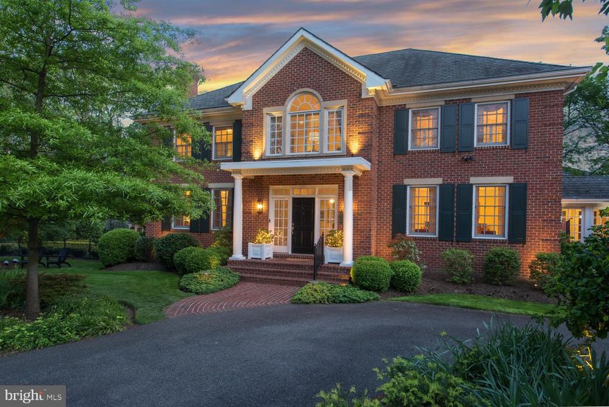 Sensational!  Beautiful , custom built, executive estate in a fabulous LOCATION! Stately  Georgian home brimming with curb appeal.  Impressive 7174 total sq ft , perfect for entertaining and casual living. Sited on  exquisitely landscaped .63 acre, double lot adjacent to parkland. Five ensuite bedrooms. TWO gorgeous porches. Rare THREE CAR,  side-loading/attached garage with circular drive.  A sheltering portico and oversized front door open to a welcoming, gracious  foyer. with four coat closets!  Stately columns and moldings frame the entrances to the classic  living room on the left and the formal dining room to the right.    A cozy wood burning fireplace and custom built-ins  display treasures  and provide a focal point  in the elegant living room.  The generous  dining room with oversized windows, is perfect for special celebrations with family and friends. This warm welcoming home offers great flow for easy entertaining and casual living. The foyer leads to a soaring two-story rotunda  and a quiet library/home office with floor to ceiling built-ins. Nine foot ceilings, hardwood floors, six panel doors, custom built-ins, and millwork add quality and stylish detail throughout the home.  Large, oversized windows and French doors fill the home with sunlight. The kitchen accommodates a family of cooks. Chefs relish the HUGE island and long counters for prep and ubiquitous cabinetry for storage! Equipped with high-end appliances, two dishwashers, double ovens, a five burner gas stove with retractable exhaust fan, table space, and a custom  "Command Center" desk , This kitchen has it all!   Gather family and friends for chili parties, game days, and movie nights in the family room that opens to the kitchen.  A custom built entertainment center, gas fireplace, and corner cupboard add architectural interest and charm.  A removable custom  gate is available to  corral toddlers and  pets.  Two sets of French doors lead to TWO fabulous three-season porches with custom awnings.  The side porch is a serene living room.  The back porch with a handsome outdoor kitchen is perfect for grilling and  al fresco dining.  Enjoy the stunning garden and woodland views! A convenient butler's pantry, powder room, two storage closets, and a mud room complete this level. . A gracious curved staircase ascends the rotunda to the second level of this extraordinary home. A magnificent Palladian window infuses the rotunda with light. A work/study area  with  matching built-in desks and shelves,  offers a quiet place to read.   A sumptuous master suite, fit for a King,  is a tranquil retreat with a romantic fireplace (gas), lounging area, and walk-in closet. The master bath has "his and her" vanities,  a walk in shower, spa, and  private water closet. Three additional  large bedrooms all have double windows, walk-in closets, and private ceramic tile baths. A convenient laundry room with storage and three linen closets are on this  level. The large, carpeted, walk-out lower level, is ideal for socializing, parties and play  with  built-ins, a wet bar and hobby area (used for dancing ).   There is a fifth bedroom/au pair/in-law/teen suite currently  used for billiards, plus HUGE utility and  storage rooms. Professional landscaping creates an enchanting back yard. Revel in the expansive, manicured lawn, mature trees and colorful seasonal  plants and flowers. Terraced stairs, lead to a stone wall and patio. where a  propane gas fire pit sets the mood for wine, s'mores and starlight discussions.  The mesmerizing Koi pond with three waterfalls rivals a resort.   A treehouse,  in-ground irrigation system, full house generator and fenced yard are additional amenities! Bordering a woodland City park with nature trails the house is at the end of a "No Thru Street":  Walk to two schools, and  Chinquapin Aquatic and Recreation Center. Near stores,  restaurants, Reagan, and major roads. Easy commute to DC, Old Town and the Pentagon, You've found your FOREVER home!