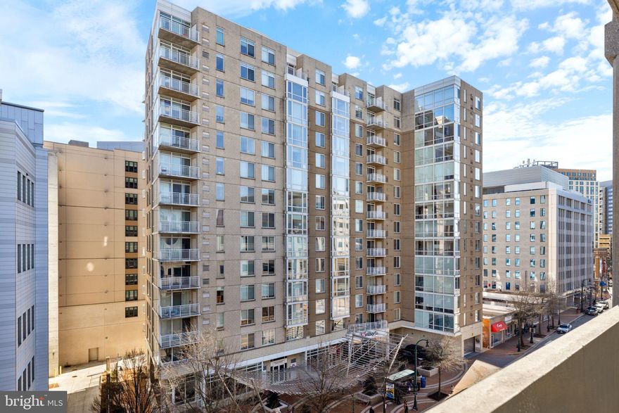 Discover a bright and modern urban retreat in the heart of Downtown Silver Spring. This light-filled condominium features a spacious open-concept living area that flows seamlessly into a gourmet kitchen complete with a large island and granite countertops—perfect for both everyday living and entertaining. Step outside to relax on your private balcony, ideal for morning coffee or unwinding after a long day. The generous primary suite offers a large walk-in closet and a beautifully tiled low step-in shower for added comfort and style. The second bedroom also includes a walk-in closet, providing ample storage space throughout. Additional conveniences include an in-unit washer and dryer and a designated garage parking space. Residents of The Crescent enjoy fantastic amenities such as on-site management, a fitness center, billiard room, exclusive resident lounge, and a pet-friendly atmosphere. Located just steps from premier dining spots like Copper Canyon Grill, Outback Steakhouse, and Kusshi, and within easy reach of the Metro, Whole Foods, Safeway, and Regal Cinemas—this unbeatable location offers the best of city living with everyday convenience.