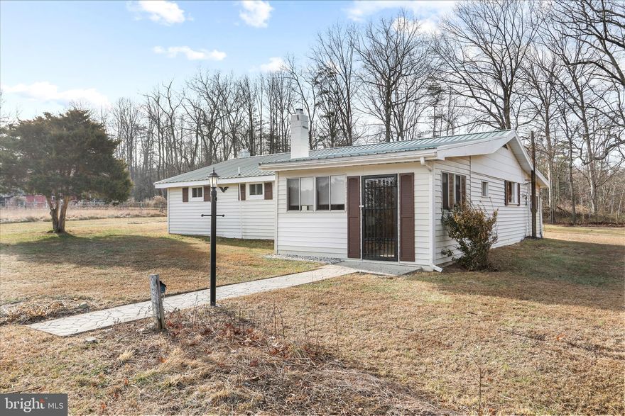 Over 5 acres of lovely property that hosts a one level home with big upgrades. A new metal roof was installed in 2024 and central HVAC installed in 2023. The beloved family property has had one owner since its construction. The property was utilized for horses for years. Approximately 2.5 acres is cleared and partially fenced. There are two sheds/garages and a small stable/run in shed.  The home is located at the end of the drive with no worries about thru traffic. The acreage has excellent usability with the possibility for a second build site. Perched perfectly on a knoll of a hillside, the views from the home are open and scenic. The interior of the home has an open kitchen, living room and dining area. There is a seasonal porch at the front of the home and a mudroom/laundry room  just off of the back of the kitchen. The circular driveway offers ample space for parking. Come and see this slice of WV heaven!