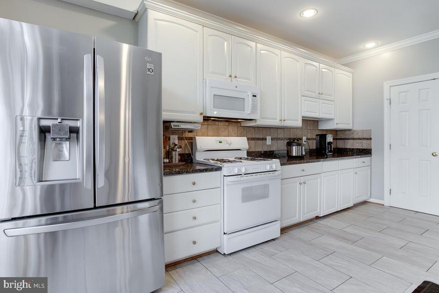 Turn-key townhome in coveted Waverly Woods is ready to fill with new memories! The home features 4 bedrooms, 3 full baths, 1 half-bath with a finished walk-out basement. Gleaming hardwood floor throughout the main level. Granite countertop with stainless steel appliances. Finished basement with full bathroom. Large recreation room in the basement with a walk-out to concrete patio. A beautiful deck, In community Grocery, restaurants, and Golf courses. New kitchen and bathroom tiles. The house has a Tesla/EV charger and a shed that goes with the house Check out this lovely home and make it your own! Total living space is about 2,470 Sqft.