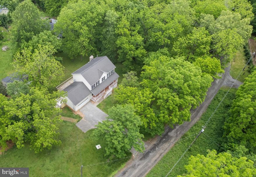 "Honey stop the car.. this is the one!" Beautiful 3 Story Colonial Home on almost 1.5 acres of private land!
Main Level offers a welcoming foyer with hall closet and stairs to upper level, Great Room with cozy wood stove, 2 ceiling fans, and plenty of space to gather. Kitchen with island, dinning space, and access to your 2 car garage and spacious and private back deck, a bonus room - perfect setting for a living room, office, play room, or whatever accommodates your lifestyle! There is also a half bath and laundry on this level. 

Upper Level features a grand primary suite with ceiling fan, sitting area, huge walk in closet, vanity desk, as well as an attached private full bathroom with walk-in shower, and jet tub to retreat and relax in. Down the hall you’ll find 2 bedrooms with a hall closet in between and full bathroom. Plus a bonus room that could easily be turned into a 4th bedroom.

But wait! There’s more — the walk out basement is just awaiting your final touches, with a wood stove, electrical and drywall already done, Plus there is a rough in for a 3rd full bathroom and 5th bedroom/ office/ gym/ movie room/ etc .Ample storage and utility room with water softener. 

Around the property you’ll enjoy being surrounded by nature. In the front there’s an attached 2 Card garage, paved driveway with plenty of parking space, large cover porch to your front door. On the back side there is a large deck off the kitchen, plus an additional oversized 2 car garage with electric.  This almost 1.5 acre property has a very  light HOA for the roads and private river access- So bring your chickens, goats, and hobbies here where they are welcomed! High speed Internet!

Nestled in a serene neighborhood, this haven is just a stone's throw away from your private river access for moments of tranquility, Mount Mission Park, Shannondale Springs Trail, the Mountain Lake Club Beach, where sandy toes and laughter abound, and a delightful bar and grill, perfect for dining under the stars or pop by the nearby convenience stores for a quick treat. This location has it all with  the Maryland and Virginia lines just a hop, skip, and a jump away, commuting becomes a delightful breeze. Let your new chapter begin here at 1118 John Brown Farm Rd