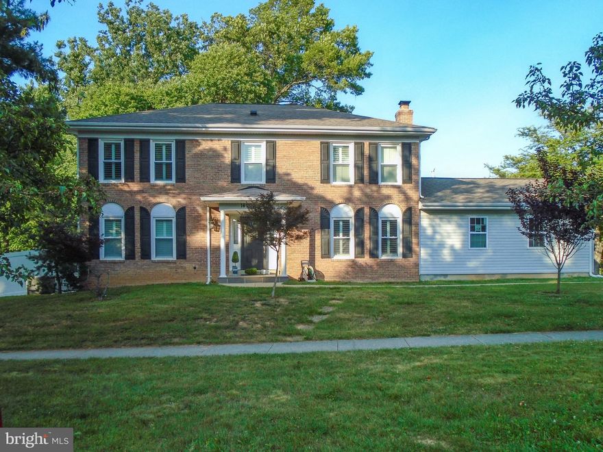 Located in sought-after Mills Farm subdivision, this stunning home underwent a complete custom renovation just over four years ago, resulting in a beautiful and modern living space. The open floor plan is perfect for comfortable living and entertaining. The main level features a welcoming open space with a kitchen open to the dining and living room area. The family room boasts an elegant fireplace with granite and custom doors. The updated kitchen includes cabinets, Cambria quartz countertops, and updated appliances. The upper level offers four bedrooms, including a spacious owners suite with two large walk-in closets and a makeup area. The fully finished basement provides additional living space with an office area, bar, and two bonus rooms, and a finished bathroom. Additional features of the property include a gas generator, recently replaced roof and siding, custom white shutters, and a backyard with a heated pool and bar area. The home is conveniently located across from a park with recreational amenities. Overall, this house offers a truly inviting and well-appointed living space.