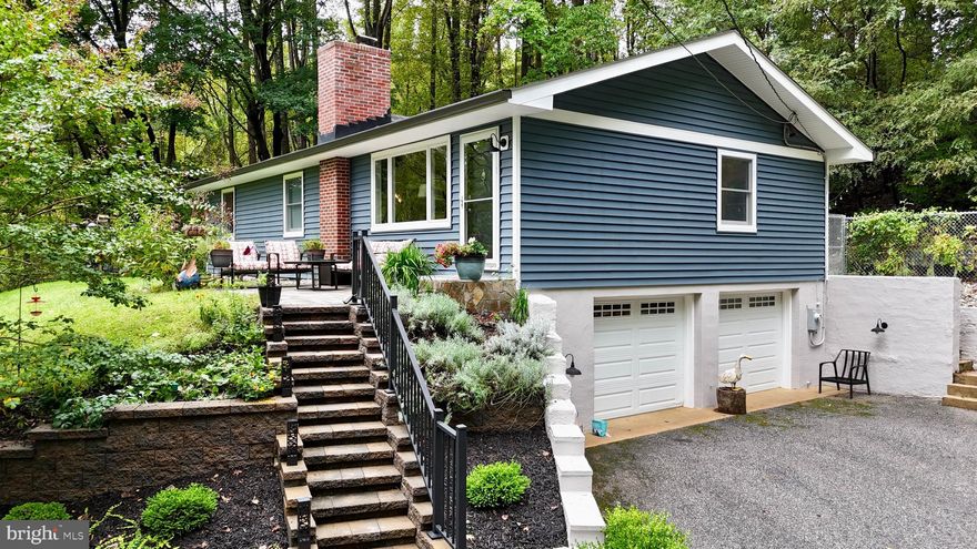 Welcome to this raised rancher nestled in a peaceful, nature-filled setting. As you drive up the tree-lined driveway, you will be greeted by this charming home perched atop a clearing. Visitors are often surprised as warm sunlight pours onto the house at the top of the hill! Step inside to find an inviting living room with large picture windows, perfect for enjoying the changing seasons, and a cozy wood-burning fireplace. The spacious dining area is ideal for entertaining, while the gourmet kitchen boasts granite counters, ample cabinets, pantry space, stainless steel appliances, and a reverse osmosis system for pristine water quality. This secluded home features three generous bedrooms and a recently renovated main bathroom with tasteful fixtures upstairs. The fully finished basement, complete with an updated full bath and large laundry area, offers plenty of space for relaxation and activities. The oversized 2-car garage offers direct access into the home and provides ample additional storage space. Numerous recent upgrades include the roof, gutters, front patio, and backyard fence. Plus, you're just minutes from all the top Hunt Valley shopping and restaurant options with convenient access to I-83. Enjoy watching the sunrise from the front yard and spending cool evenings by a fire on the back patio - truly a special location! Schedule your showing today to see this hidden gem!