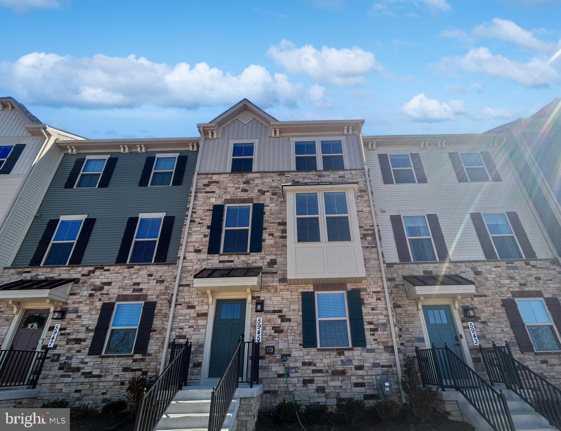 BRAND NEW Never lived in, stunning New 3-Bedroom, 2.5-Bath Townhome with Mountain Views and an Outdoor Deck. This beautiful townhome offers the space and customization options of a single-family home, paired with the convenience of low-maintenance living. The open-concept design flows seamlessly into a stunning modern kitchen, complete with an island that's perfect for gatherings and entertaining. A sun-filled Morning Room, surrounded by windows, provides a charming dining area. With quartz countertops and stainless steel appliances, this kitchen is truly a chef's dream. Upstairs, an elegant staircase leads to three generously sized bedrooms and 2.5 baths, along with a convenient second-floor laundry room. Ample closet space throughout ensures easy organization and storage. The Owner's Suite is a true retreat, featuring a tray ceiling, a massive walk-in closet, and a luxurious Owner's Bath with a soaking tub, a separate shower with a built-in seat, and spa-like finishes. Designed with both style and functionality in mind, this home blends modern convenience with timeless comfort. Enjoy breathtaking mountain views right from your home. With a 2-car garage and never having been lived in, this home is ready for you to move in and make it your own. 
Don't miss out on this opportunity to experience the perfect balance of elegance, space, and low-maintenance living!