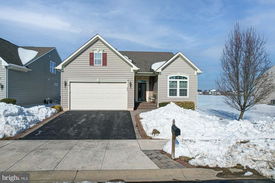 Welcome to 633 Southerness Dr - an immaculate home at an enticing price, located in one of our area's premier 55+ communities, Legacy at Odessa National. Legacy at Odessa National offers an active-adult lifestyle with access to the Odessa National clubhouse and fitness center, plus seasonal community pool access, and golf perks including discounted membership/greens fees and up to four free rounds annually. Residents also enjoy outdoor recreation like walking trails, tennis, and other resort-style features. Upon arrival to 633 Southerness, you will not the stunning paver walkway that welcomes you to the front porch, a beautiful welcoming to an even more stunning home. Upon entry, hardwood floors and tray ceiling detail make a grande first impression, and a bedroom with vaulted ceilings and tall, bright windows has access to a full hall bathroom. Continue through the home where you'll find main floor laundry just off the access from an oversized two-car garage, a dining room with French doors, and a stunning two-story great room with natural gas fireplace. The incredible open concept living space is open to the eat-in kitchen, where stunning upgraded cabinetry offers endless storage space, corian countertops, tile backsplash, and stainless steel appliances make for a functional and stylish space to cook and enjoy company. Just off the kitchen, a beautiful enclosed rear porch and deck is the perfect place to enjoy stunning views of the open space behind the home overlooking the golf course. The primary suite has beautiful tray ceilings, walk-in closet, and a large primary bath with his and hers vanities and a walk-in tile shower. Upstairs, an incredible loft offers additional living space, perfect for guest overflow, game nights, or a perfect hobby space, and an additional bedroom and full bath make for the perfect guest retreat. The unfinished basement has incredible tall ceilings, and is full of surprises like an under the stair pantry, built in storage shelving, even a workshop with built-in work bench, shelving and storage. This home has been meticulously and impeccably maintained, and offers incredible opportunity to join one of Townsend's most beloved communities - don't miss your chance!