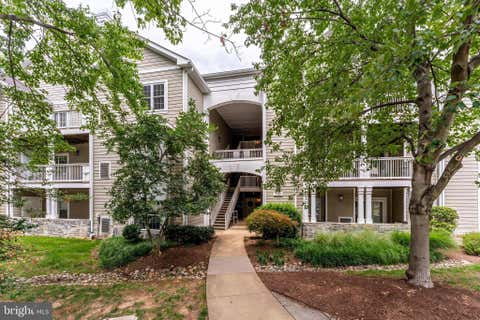 Photo of 1700 Lake Shore Crest Drive #25, RESTON, VA 20190 (MLS # VAFX2330778)