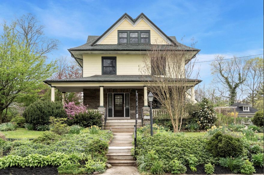 This grand turn of the century Colonial home beautifully blends historic grandeur with modern comfort in the heart of Elkins Park. Built in 1906, this three-story masterpiece sits on a lush 0.34-acre lot, welcoming you with a classic front porch and a breathtaking botanical landscape.The property is a nature-lover’s dream, featuring "well-loved gardens" with a variety of blooms. At the end of the long driveway, you'll find a fabulous two-car detached garage that offers endless potential. Spanning approximately 3,208 square feet, the interior boasts 6 spacious bedrooms and 3 full baths. Main level highlights include exposed hardwood floors, original wood moldings, a formal dining room, and an updated kitchen with a convenient main-level laundry. The second floor offers four bedrooms and a full bath, while the third floor provides two additional bedrooms and another full bath. Peace of mind comes with a new main roof (2020), two-zoned high-velocity central air conditioning (2014), and replacement windows throughout. Situated on the incredible block of Spring Avenue, the home is a quick two-minute walk to the Elkins Park SEPTA station for an easy commute. Local favorites like Creekside Market & Tap, High School Park, and various downtown eateries are just steps away.