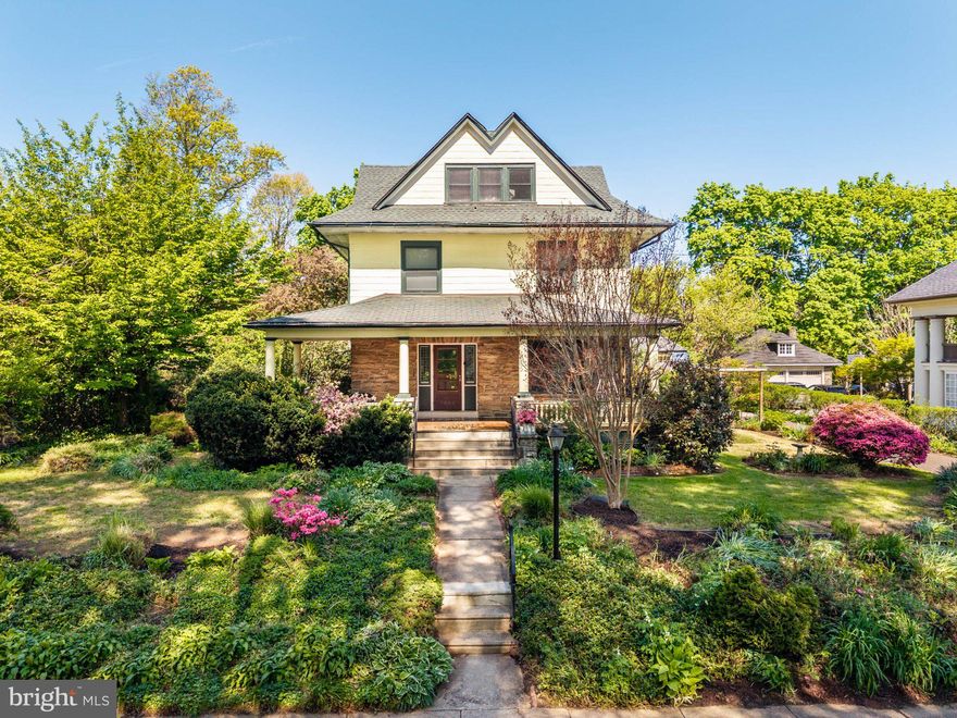 This grand turn of the century Colonial home beautifully blends historic grandeur with modern comfort in the heart of Elkins Park. Built in 1906, this three-story masterpiece sits on a lush 0.34-acre lot, welcoming you with a classic front porch and a breathtaking botanical landscape. The property is a nature-lover’s dream, featuring "well-loved gardens" with a variety of blooms, including blueberry bushes that produce heaps of fresh fruit annually. From March to November there is always a floral bloom on the property.  At the end of the long driveway, you'll find a fabulous two-car detached garage that offers endless potential. Spanning approximately 3,208 square feet, the interior boasts 6 spacious bedrooms and 3 full baths. Main level highlights include exposed hardwood floors, original wood moldings, a formal dining room, and an updated kitchen with a convenient main-level laundry. The second floor offers four bedrooms and a full bath, while the third floor provides two additional bedrooms and another full bath. Peace of mind comes with a new main roof (2020), two-zoned high-velocity central air conditioning (2014), and replacement windows throughout. Situated on the incredible block of Spring Avenue, the home is a quick two-minute walk to the Elkins Park SEPTA station for an easy commute. Local favorites like Creekside Market & Tap, High School Park, and various downtown eateries are just steps away.