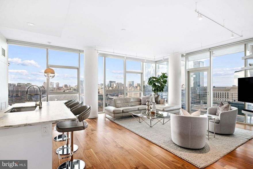 Highest floor for this 3 bedroom, 2.5 bath, 1,550 square foot corner apartment at One Riverside Condominium. Soaring North and West views from 10’ high glass windows. Walnut floors, Lutron electric blinds, deluxe kitchen with Wolf oven and gas cook top, Sub-Zero refrigerator, Miele dishwasher and washer/dryer.  Beautiful marble in all baths and kitchen coutertops. Balcony to enjoy the river, museum, skyline and sunset views. First time offered. Includes storage unit and 1 valet parking spot.  3-zone HVAC. One Riverside is an award-winning luxury condominium with full-service amenities, including 24-hour concierge, fitness center with heated indoor 60' lap pool, Peloton, locker rooms, saunas, steam room, and showers. Amenities also include a club room with catering kitchen, boardroom, guest suite, chauffeured town car and private landscaped front garden and back patio with outdoor grill and television. Wonderful location steps from the Schuylkill River Park and Trail, close to University of Pennsylvania, HUP, Drexel, restaurants, shops, dog parks, 30th Street Station, Fitler and Rittenhouse Squares, public transportation and all Center City has to offer. 1 car valet parking spot for $300/month or $330 for EV.