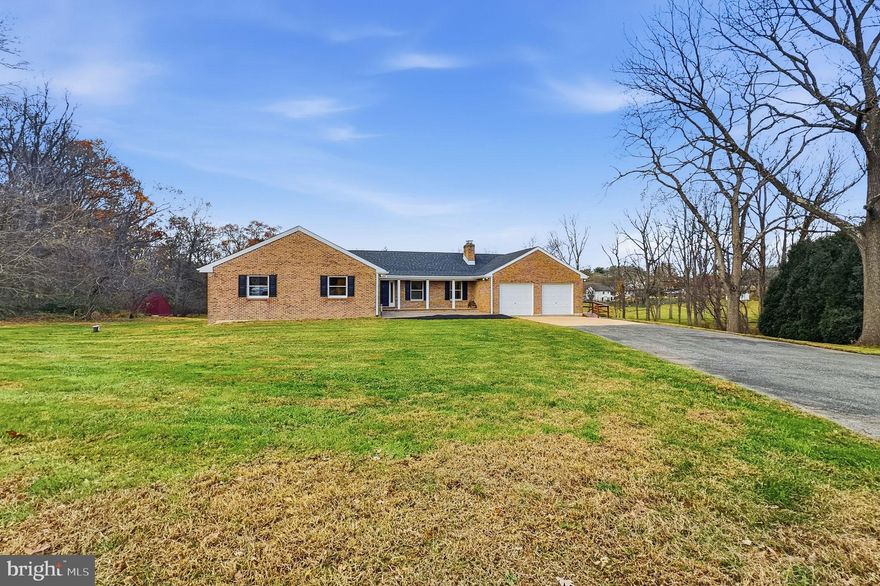 Welcome to this spacious custom-built brick and concrete ranch home located in Lincoln University. Offering nearly 4,000 square feet of living space on over 5 acres, this property provides extensive room and versatility. 

A large central foyer provides access to the formal living room with a floor-to-ceiling granite and Pennsylvania Blue Stone fireplace, a formal dining room, an oversized great room with deck access, and a sunroom featuring vaulted ceilings, abundant windows, and additional deck access. The recently remodeled kitchen features an open floor plan, an 8-foot island with a second prep sink, breakfast/eating area, LG Professional appliances, a 36" convection ceramic glass cooktop with matching exhaust hood, pot filler, wall oven with microwave/air fryer combination, French door refrigerator, dishwasher, two disposals, two 16-gauge Ruvati sinks, recessed and pendant lighting, and extensive cabinet storage.

A mudroom/laundry area with garage access, along with an office/optional bedroom and powder room, completes the main level.

The walkout lower level features a newly built covered stone patio with recessed lighting and a ceiling fan, a full bath, three additional bedrooms, a large family room, a media/game room suitable for a home theater, and a spacious storage/workout area.

Recent upgrades include a new 4-ton heat pump, roof, lighting, LVP flooring, custom ceramic tile baths with quartz tops and Kohler fixtures, solid wood doors, and a refinished diamond-pattern deck.

Exterior highlights include an additional front stone patio, extensive exterior lighting including the portico, a two-car garage, paved driveway with parking capacity for over 10 vehicles, 5 open acres offering privacy, a well head suitable for future garden irrigation, and an oversized shed with front and rear access and vaulted ceilings. The home also features generous storage options throughout, including large bedroom closets, two walk-in closets in the main bedroom, multiple additional closets, lower-level storage, and a walk-up attic with more than 2,000 square feet of potential storage space.

Schedule your showing today.
