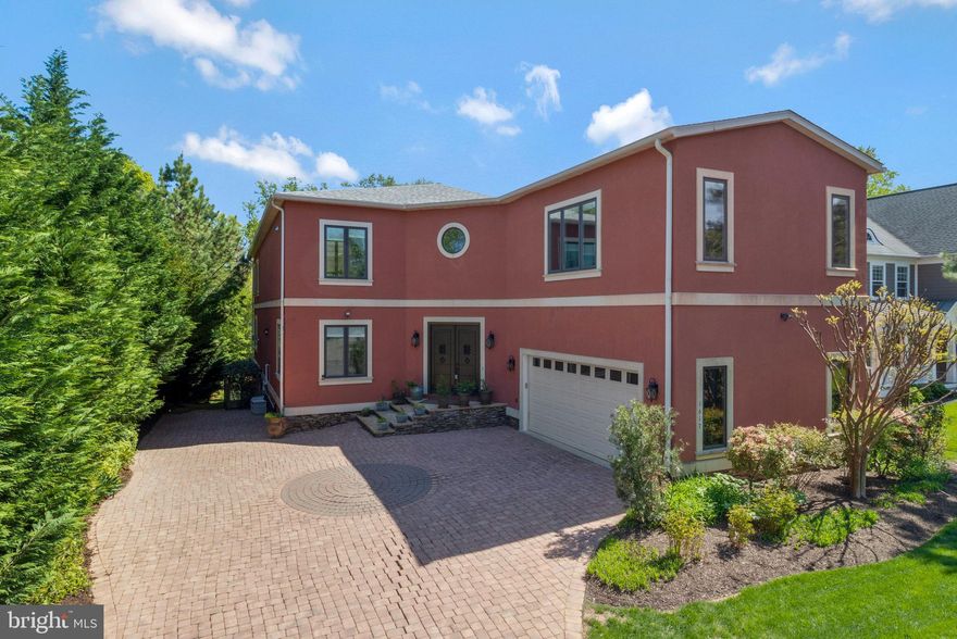 Significant Price Reduction! Open House Saturday 12-2PM. Experience the epitome of luxurious living in this French-inspired contemporary masterpiece. Nestled in the heart of McLean, this exquisite property spans nearly 8,000 square feet on a lush half-acre lot, offering a blend of sophistication and high functionality tailored for entertaining and enjoying life to its fullest.

The home boasts a stunning atrium foyer leading to a meticulously designed layout that includes five spacious bedrooms, 5 full baths, and one half bath across three beautifully appointed levels. The chef’s kitchen, inspired by Michelin-star standards, features top-of-the-line KitchenAid Architect Line appliances, custom bamboo cabinetry, and a grand center island with seating for 14, making it a culinary enthusiast’s dream.

Central to this magnificent home is a breathtaking indoor pool and spa area, enclosed by two walls of retractable glass doors and complemented by a sheer descent waterfall—perfect for both serene relaxation and lavish gatherings. The master suite offers a private sanctuary with panoramic views of the pool, a vast walk-in closet, and a spa-like bath.

Additional luxuries include a geothermal heating and cooling system with dedicated zones, eco-friendly bamboo flooring throughout, and two expansive no-maintenance decks made from recycled materials, ideal for outdoor entertainment.

Located just minutes from Tysons Corner and the McLean Metro Station, and a short commute to Washington D.C., 1617 Kirby Road isn’t just a home—it’s a lifestyle.