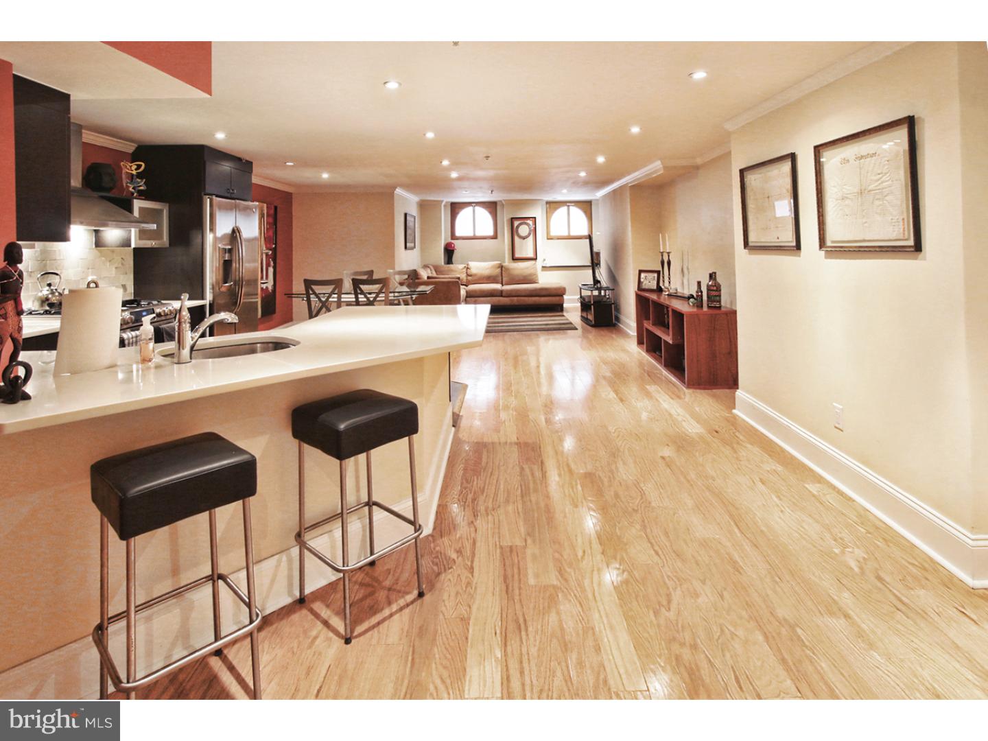 HANDSOME AND MODERN IN AN UNBEATABLE LOCATION---This contemporary, completely custom 1 bedroom, 1.5 bathroom home features a spacious open floor plan and designer finishes throughout. There is a large foyer with beautiful Travertine floors that leads to an open great room with pristine hardwood floors, modern finishes and crown molding. An open, custom-built kitchen includes Zodiac countertops, wood cabinetry, stainless steel GE refrigerator, GE profile microwave, Vigo hood, Bosch dishwasher, and an extra deep stainless steel sink with Dornbracht faucet. A large master bedroom offers his and hers walk-in closets with built-in shelving, hardwood floors, and a spacious spa-inspired ensuite bath with custom his and hers wood vanities, Toto toilet, and an oversized walk-in shower appointed in marble with floor to ceiling frameless glass doors. There is half bathroom off of the foyer and a separate laundry closet housing a Samsung stackable washer and dryer.  2047 Walnut Street is a beautifully renovated boutique brownstone condominium building located less than a block from Rittenhouse Square. This luxury building is conveniently located within walking distance of the business district, high end dining and retailers, nightlife locations, historic landmarks, museums, and theatres. A picturesque courtyard in the center of the complex offers residents grill access and bike storage. Great for a pet! Multiple parking lots and garages are located within one block.  2047 Walnut combines character with modern style in a highly coveted location. Experience the ultimate in luxury city living while being in the center of it all.