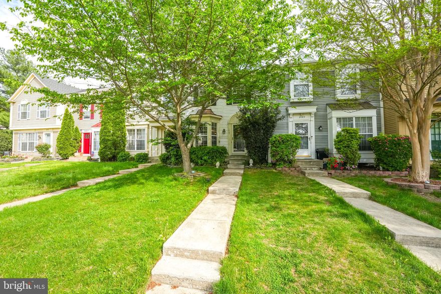 2 primary bedrooms on the upper level, each with its own full bathroom.
Nice-sized kitchen with table space. Gas stove, built-in microwave, and granite countertops.  Dining space has crown molding and chair railing. Nice-sized family room with sliding glass door going to deck.
The lower level has a rec room with a fireplace. The washer/dryer is located in the lower-level storage room. Full bathroom downstairs. Walk out to the brick paver patio and fenced backyard.