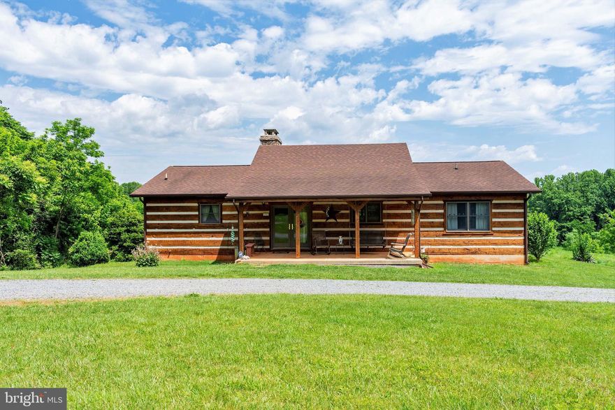 Beautiful 3 br 2 ba  log home on 70 acres!Hardwood floors, full basement , pond, gas fireplace, stainless steel appliances.  It is in conservation easement, can build one more house on property.   Average  electric $50.00/mo!  Built in 2001 with a  50 yr roof. Central ac, Gas/propane heat. This property is a hunters paradise, wild turkey and deer!  Come see all the beauty in this home and property.