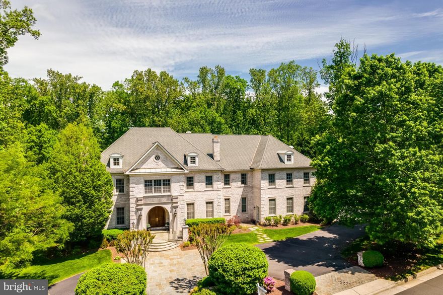 Presenting a magnificent custom estate in the highly coveted Reserve of McLean, perfectly situated on the prestigious Founders Ridge. This recently revitalized home exemplifies luxury living with its exceptional craftsmanship, soaring 10-foot ceilings, and grand 8-foot doors throughout. The property sits on over an acre of beautifully landscaped grounds, offering both privacy and a sense of grandeur in one of McLean’s most exclusive communities.
Step inside to discover a phenomenal floor plan designed for both elegance and functionality. Expansive windows fill the home with natural light, highlighting the open, airy living spaces and exquisite architectural details. 
The daylight lower level is a true entertainer’s paradise, boasting a custom recreation area, fitness room, and guest suite, all with direct access to the lush backyard.
Enjoy outdoor living at its finest with expansive patios, resort-style pool options, and beautifully manicured gardens-ideal for gatherings or peaceful relaxation. The Reserve’s renowned amenities include 24/7 manned security at the iconic gatehouse,  home monitoring services, and a vibrant sense of community, all within minutes of downtown McLean and Washington, DC.
This is a rare opportunity to own a distinguished residence on Founders Ridge, offering a blend of privacy, sophistication, and convenience in one of Northern Virginia’s premier neighborhoods.