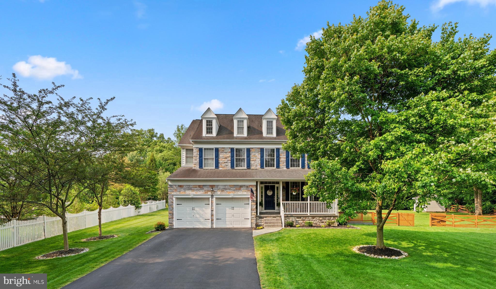 Welcome to this stunning stone-front Colonial with four bedrooms and four bathrooms, situated on a private and spacious one-acre lot. With over 4,400 square feet of finished living space and an open floor plan, this home offers an exquisite setting for comfortable living. As you enter the home you are greeted with high ceilings and a formal living and dining room. The kitchen is a chef's delight, offering abundant storage, top-of-the-line stainless steel appliances, gorgeous granite countertops, and an adjacent sun-filled morning room that fills the space with warmth and natural light. The spacious family room is the perfect gathering spot, enhanced by a cozy gas fireplace that adds a touch of comfort and ambiance. The primary bedroom is generously sized and includes a comfortable sitting area, a walk-in closet, and a full bath. The upper level encompasses three additional bedrooms and another full bath, providing plenty of room for family and guests. The basement is a true entertainment haven, featuring a custom kitchen/bar, and a movie theater for hours of enjoyment. Stepping outside, you'll discover a tranquil backyard oasis beckoning you to unwind and entertain. A delightful patio invites you to soak in the surroundings, while a convenient built-in grill awaits culinary adventures. The fenced yard offers privacy and security, while also providing ample space for outdoor activities and recreation. The garage is equipped with high-speed EV (Tesla) charger! With its proximity to major highways, this home offers both convenience and accessibility, making it an absolute must-see for discerning buyers seeking a harmonious blend of luxury, comfort, and style.