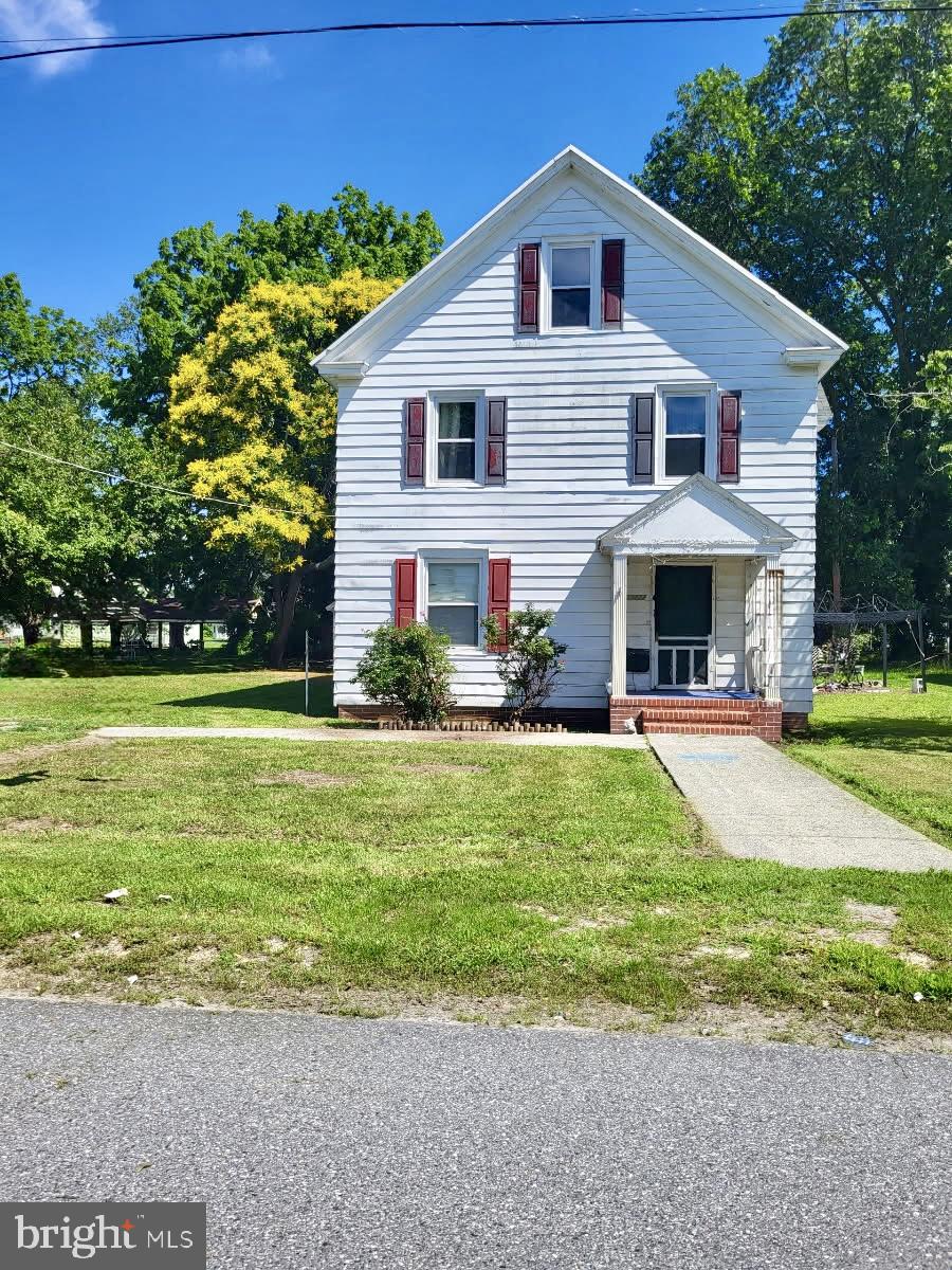 Waiting on the new owner to recognize the work that has been done to this grand lady. Up-dates have included central air and heat, dual zone, and new windows, just to name a few. The original hardwood floors are under the carpet. Large rooms and an eat in kitchen with a screened porch off the back. Rare for in town a nice garage for tools and lawn equipment. The home just needs some TLC to be back to the lovely home it can be. This may be an assumable VA loan.