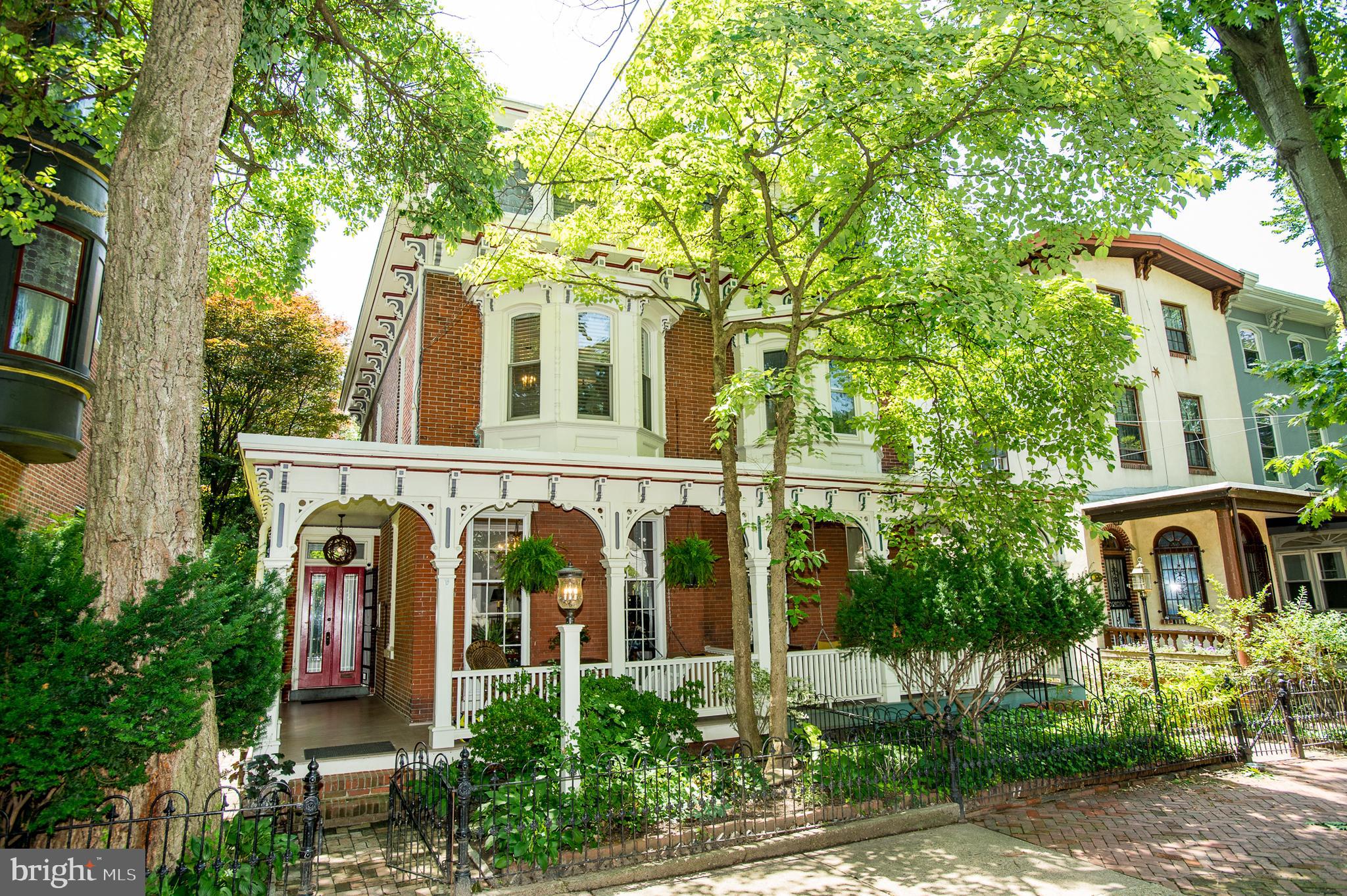 Absolutely Stunning Victorian Brick Home in Historic Powelton Village Neighborhood - minutes from Drexel and Penn Universities, Home to award winning Powell Elementary and the Science Leadership Academy Middle Schools. This Special home has been Renovated and Enjoyed by Current Owners who spared no expense to retain the Classic Victorian Style and Architecture while adding the highest end Modern Amenities. Your New Home currently Functions as a 2 Unit Property- perfectly set up for an In-Law or Au Pair suite in the first Floor Apartment with the Primary Residence Occupying the 2nd and 3rd Floors - or you could Live in the Primary Unit and Rent the first Floor Apartment. Also Perfect for a Home Office. Powleton Village is a sought after neighborhood with incredible Walking and Biking Scores, Extra Wide Sidewalks and Ample Parking on both Sides of the street. You will love the Newly rebuilt Mahogany Wrap around Porch and Brick Walkway extending from the front of the home to the Rear Patio and Garden - All surrounded by Wrought Iron Fencing and Security Gate. Enter thru the Foyer which has access to both the front Porch and the Rear Garden. Just off the Foyer is a Stunning Parlor/Bonus Room with floor -to ceiling windows that could also make a great Home Office. From the Foyer, you can Enter the First floor, 1 Bedroom 1 Full Bath Apartment with beautiful Hardwood Flooring Throughout -Updated Kitchen and Bath plus Bedroom which also has a direct Door to the back Garden/Patio. Upstairs is the Primary Unit with an open floor Plan featuring a Large Front Bedroom/Office, Living Area, New Half Bathroom, and a Step Down Renovated Kitchen with Hydronic Radiant Heat Tile Flooring, In - Countertop Induction Stove- top Cooking, Recessed Lighting, Top end Appliances, and Custom Cabinets and Counters. Step out the Kitchen through your Pella sliding Door onto a Brand New Deck that Overlooks the Rear Garden - Perfect for morning coffee! The Primary Suite is Located on the 3rd Floor (2nd level of the Primary residence) and Features a Large Front Bedroom, built in Closets and a Brand New Custom Bathroom with Radiant Tile heat Flooring and Automated Kohler Shower System - Plus Built in Washer and Dryer. The entire Home has been re-plumbed with Pex Plumbing, and Re-wired with modern Electric. Features Dual Zoned Central Air with a Brand New Unit for the 2nd and 3rd Floors - Also New Zoned hydronic heating for the Boiler and Hydronic Radiant Heating for the Flooring. Many New Windows throughout, Plus Whole Home Water Filter and Softener. Large Full Basement (could be easily finished) - with High Ceilings, Washer and Dryer for the First Floor and Steps leading to the Back Patio/Garden. Prime Location and everything you could want to blend modern Living with a Classic Victorian Charm!