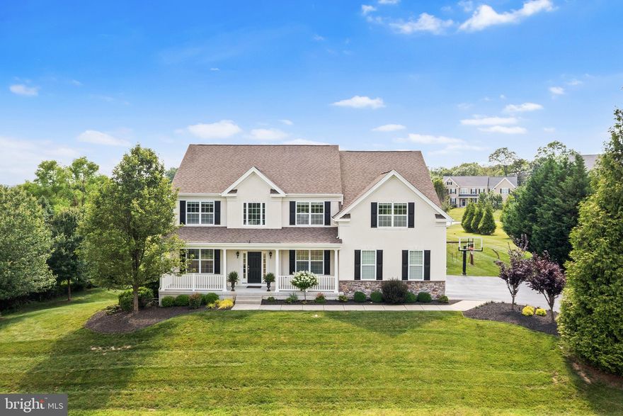 Showings begin Wednesday, July 23rd. Located in the prestigious Preserve at Squire Cheyney Farm, this exquisite farmhouse-style colonial (and former model home!) is loaded with luxurious finishes and upgrades, including expanded breakfast and family rooms. A tree-lined driveway leads to the inviting front porch, setting the stage for sun-drenched, open-concept interiors with gleaming hardwood floors, oversized windows, custom cabinetry and elegant architectural details. The two-story foyer makes a grand impression with its distinctive staircase, flanked by a formal dining room with classic wainscoting and crown molding. Steps away sits the high-end chef’s kitchen with center island, double wall oven and closet pantry. The kitchen opens to a windowed breakfast room on one side and a vaulted great room with gas fireplace on the other. A private home office, front living room, spacious mudroom with built-ins, laundry area and seamless access to a two-car garage with new doors and custom shelving complete this dazzling main level. Upstairs, a Juliet balcony leads to a primary suite with sitting room, walk-in closets with custom shelving and a spa-like bath with soaking tub, water closet and dual vanities. The upper level also includes three secondary bedrooms (one with an ensuite full bath) and a hallway bath. The unfinished, walk-out basement with newly sealed floor and nine-foot ceilings offers incredible potential, while the gated Trex® deck and expansive side yard create a sumptuous outdoor retreat. This residence features a full-house generator, providing reliable backup power for uninterrupted comfort and convenience. Enjoy all this plus direct access to walking trails and scenic Cheyney Farm Park, top-rated schools, West Chester and Newtown Square shopping and dining and convenient access to major commuter routes.