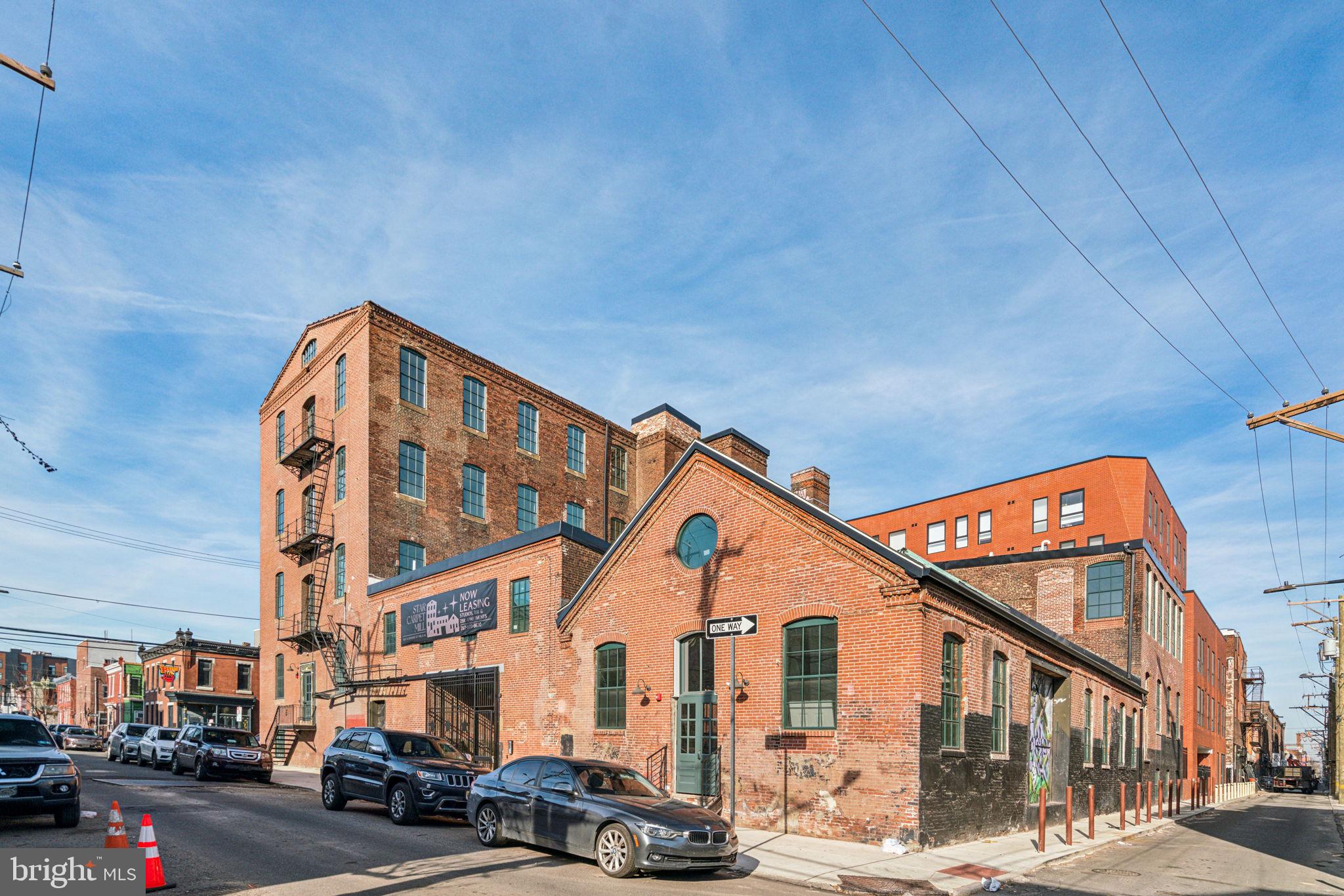 Incredible opportunity to work with the developer to fit out this incredible space and make it into a special apartment! Currently a large, open and beautiful industrial space, - turn this into your dream apartment! Convertible to a huge 1 bedroom plus den floor plan - 2 bedroom, 1 bathroom home. Welcome to Star Carpet Mill apartments located in the heart of Fishtown / Old Kensington. This boutique building is comprised of 29 residential units with Studios, 1 Bedroom and 2 Bedroom residences. Ideal for those seeking a home that blends historic charm with contemporary amenities including an elevator, mail room, and courtyard for residents! Each apartment features stunning wood beam ceilings and expansive windows. All units have been fully updated, including modern kitchens and bathrooms for the perfect balance of old-world appeal and modern convenience. Conveniently located in one of Philadelphia's rapidly expanding neighborhoods, this property is just steps away from the Berks "El" Station, directly on the primary bike lanes, and a short walk from the vibrant shops and restaurants of Fishtown. Pets welcome. Please note these photos are of a similar layout, all finishes are the same.