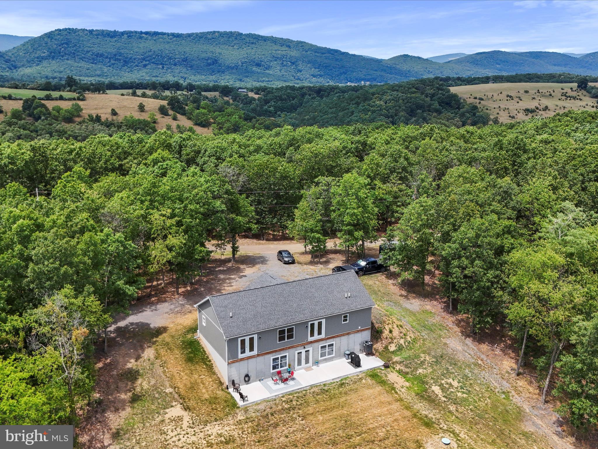 There's only one word to describe this one -- WOW! Offering the BEST views of West Virginia that money an buy, this 2022 new home is perched high atop your own private 23 acres. The list of details on this one is too lengthy to mention... from the 9 foot ceilings, to the full basement waiting to be finished (with rough plumbing already done!), to the 2x6 construction, LED lighting, custom front door.... you get the picture! The rear of the house is already structured for a deck along the entire length. These kinds of opportunities don't come around often, you don't want to miss this one!!!