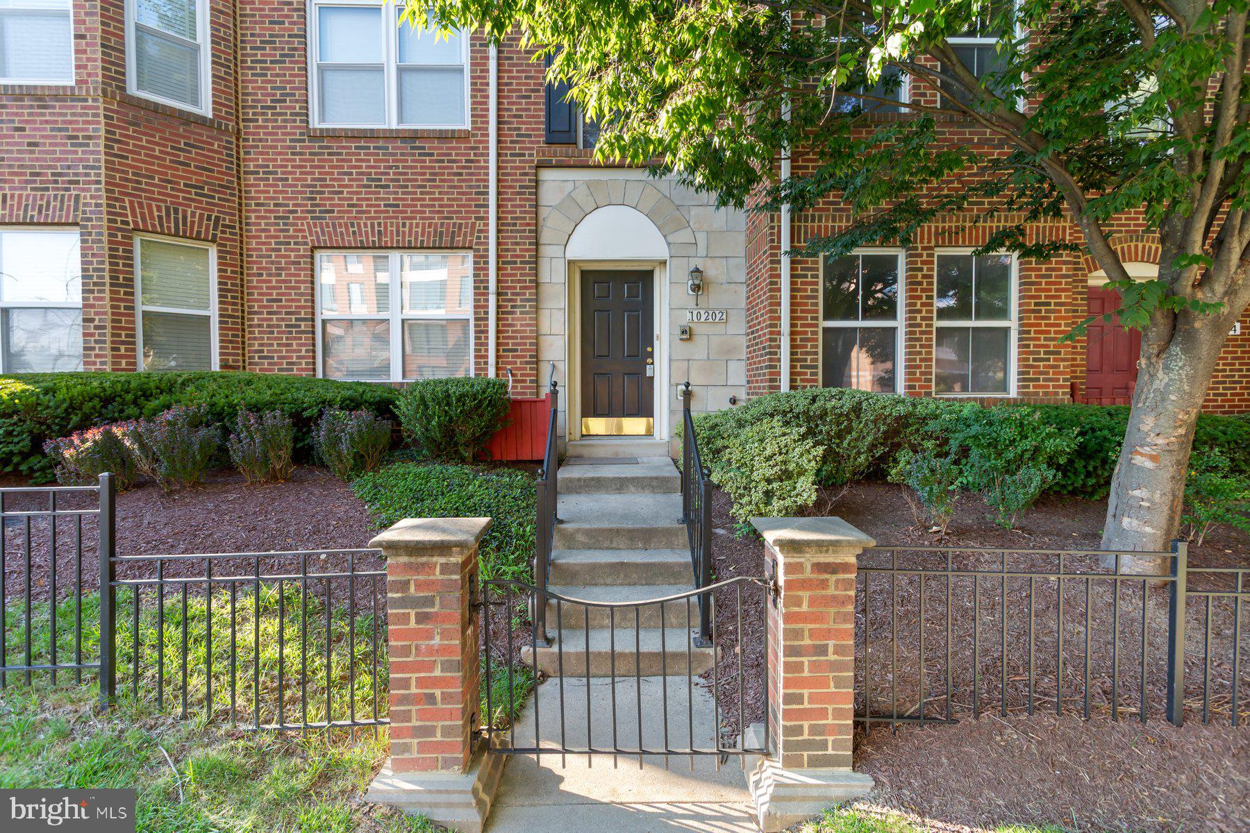 Nestled in the vibrant heart of downtown Columbia, this former model townhome offers three bedrooms and two‑and‑a‑half baths in a sleek, low‑maintenance layout with townhouse ease and suburban peace of mind. Walk into your main level rec room/home office, featuring built‑ins and a cozy gas fireplace, next to a convenient laundry/util room and attached two‑car garage—a perfect blend of functionality and flexibility.
Upstairs, the open bumped‑out kitchen opens into a bright dining and additional living area—all flooded with natural light. A formal living room and optional dining space add entertaining versatility, and there’s a stylish powder room for guests.
The top floor delivers a spacious king‑size primary suite with vaulted ceilings, a walk‑in closet, and a luxurious bath that includes dual vanities, a soaking tub and separate shower. Two additional full bedrooms (queen‑size and full‑size) share a second full bath—ideal for family, guests, or a dedicated workspace.
Freshly painted throughout with new plush carpeting and dual‑zone HVAC ensures comfort on every level. Want walkable lifestyle? You're just two minutes on foot to Columbia Mall shops and restaurants, a relaxed ten‑minute stroll to Merriweather District concerts and events, and surrounded by Columbia’s beautiful bike paths and walking trails right outside your front door.
This is ease, convenience, and Columbia living at its very best—a move‑in ready opportunity that combines low‑maintenance maintenance living with high energy lifestyle vibes.