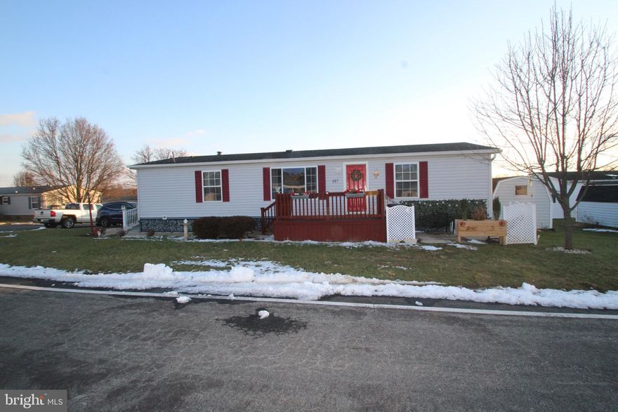 Lovely upgraded home in the attractive and convenient community of Pheasant Ridge. Community pool, gym, playground, basketball courts  are a plus and included in the lot rent plus cable and trash are included. Ramps added for easy access and a 2 level deck for enjoying the good weather.  hardwood floors LR, DR, Kitchen. handicap owners bath added. A lovely built in kitchen seating area and All appliances stay, the painted kitchen cabinetry is on point with current trends and a beautiful tile backsplash completes the look. The wood burning fireplace offers warmth and charm. A new gas furnace and central air were added in 2021. 
Just move right in and unpack your boxes…everything is done for you! This one is worth a look.