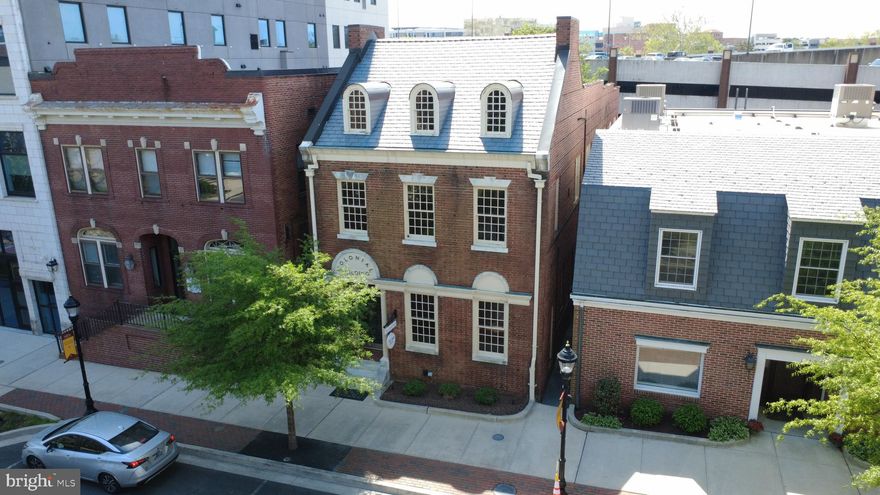 The historic "Colonial Building" is a renovated and modernized 5,500 SF office location in the heart of downtown Salisbury located on Main Street across from the Government Buildings and Post Office.  All of downtown's other offices, restaurants and retail shops are all within a convenient distance.  Metered and permit street parking in front with direct access via a paved alley to 3 private parking spots and the public parking garage directly to the rear of the building.  This building is perfect for any professional user desiring to be in the downtown district and wanting to be centrally located close to main transit routes.