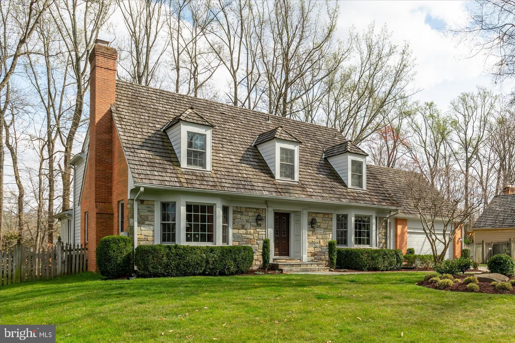 This rarely available, attractive stone front Gosnell cape cod/colonial with dormers and double bay windows exudes charm and character inside and out. Located on a quiet 1/3 acre in one of the most beautiful sections of River Falls, this home offers prized proximity to the bike path leading to the popular neighborhood swim/tennis club. Owned by one family for 29 years, this home is well maintained and move-in ready. Inside, the center hall plan offers a formal Living Room with crown moldings and a wood burning fireplace on the left and very nicely proportioned Dining Room with crown moldings, chair rail and wainscoting on the right. The bay windows cast beautiful light into these rooms. The casual living space is found in the back half of the home with a wonderful, comfortable open Kitchen/Family Room arrangement. The Kitchen with a large eating area has Williamsburg-style brick enclosure around the cooktop and wall ovens, lots of cabinetry for storage including a center island, Silestone counters and a walk-in Pantry adjacent to the must-have laundry/mud room. The Family Room is a perfect gathering place with beamed ceilings, a wet bar, built-ins and a wood burning fireplace. If you want a peaceful spot to read a book or just relax, head to the Sunroom with three walls of windows overlooking the backyard. Upstairs is a large Owners Suite with a dressing area, custom closets and a renovated Owners Bath with a stall shower and soaking tub. Two other generously proportioned bedrooms and a renovated hall bath complete the Upper Level. The Lower Level includes a terrific Recreation Room with a wood burning fireplace, a game table/billiard space and built-in bar. If you need to work from home, this lower level has the perfect home office with a separate entrance, small reception/waiting area and private office and full bath. If you don't need the office space, then this could become transformed into an Au Pair Suite/studio-you name it! For spring/summer entertaining, invite your friends over for a barbecue and relax on the back deck overlooking the lawn and trees. It's a wonderful, private setting, a sanctuary with great bird watching. Kolbe & Kolbe windows on main house; Anderson windows in Sunroom. Lawn irrigation system front & back, security system, hardwood floors on main and upper levels, 2 whole house surge protectors, professional hardscaping/landscaping incl. a flagstone walkway with a brick border; a second entrance directly into the mud/laundry room. Carderock ES, Pyle MS and Whitman High School, ranked #1 high school in MD by US News & World Report. Ideally located just off the Clara Barton Parkway, River Falls offers easy access to all major commuting routes: I-495, the Beltway, north to the I-270, BioMed Corridor or south to Tyson's Corner, VA or the parkway into downtown Bethesda or DC. Both area airports are within a half hour non-rush hour drive. For the outdoor enthusiast, Great Falls National Park is minutes away for hiking, kayaking, climbing the stone face of Billy Goat Trail, biking into Georgetown or, at this time of year, enjoying a leisurely stroll through the amazing bluebells and other spring ephemeral wild flowers on the trails. In another two months, the River Falls Swim/Tennis Club will be in action with a winning MCSL swim team and a Junior Tennis Team. Other activities include men's and women's tennis teams, pickle ball, Camp River Falls and the ever popular July Fourth parade and picnic. Look no further--you have found one of the best neighborhoods in Potomac and beautiful home with a stellar location within the community. Make it yours today!