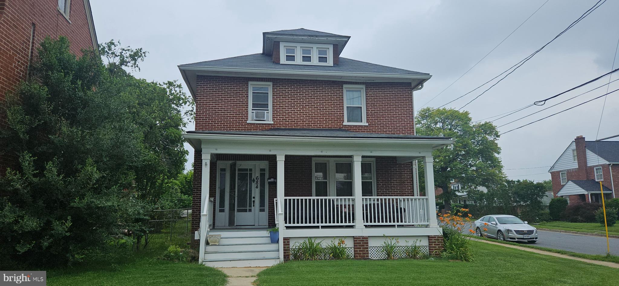 Come check out this 4-bedroom 1.5 bath 4 level Brick Colonial with a Detached Garage all on a double lot, updated roof, windows, new plumbing & water heater, updated electric & panel box. There is plenty of room to grow and put your flavor in the walk-up attic and basement. Home has the original Hardwood floors & Beautiful Woodworking that has never been painted on the main level. Large, Covered Front & (2) Back Porches to relax on. This is a pretty large lot with many possibilities in town close to shopping & downtown.