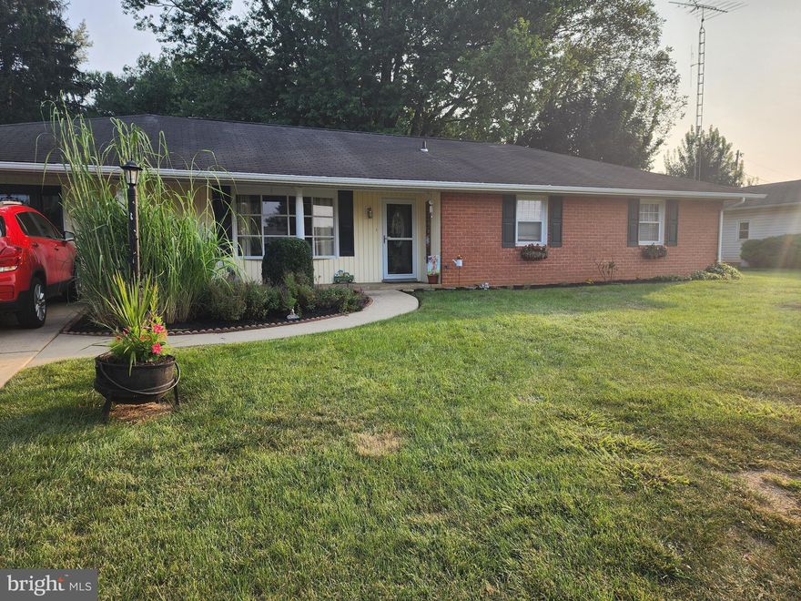 Welcome to this delightful brick rancher located in the desirable Meadowbrook development. Featuring 3 bedrooms and 1.5 baths, this home blends classic charm with thoughtful updates. Beautiful hardwood floors flow throughout much of the home, with additional hardwood preserved beneath the carpet just waiting to be uncovered. There is access to the full bath form both the hall and Primary Bedroom.

Enjoy newer windows, a spacious dining room with plenty of natural sunlight, and an inviting living room with two outside entrances and a cozy propane fireplace. The kitchen is generously sized—large enough to comfortably accommodate a dining table—while the laundry area—just steps away—includes ample storage and a convenient pantry. For year-round comfort, the HVAC system was replaced in 2020.

Full attic access is available from the living area, which was once the garage, providing additional versatility. The generously sized backyard features two sheds: an 8x10 storage shed and a larger 13x15 workshop-style shed complete with cabinets, electric, and shelving. A welcoming patio with table and chairs makes outdoor entertaining a breeze.

Located close to the interstate, medical centers, shopping, and restaurants, this home offers both convenience and comfort. Don’t miss your chance to see it—call today to schedule your private showing!