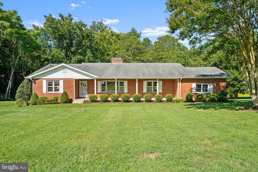 Discover this classic Original Owners 3 Bedrooms and 2 Full baths all brick Rambler with full basement sitting on 2.98 acres in Upper Marlboro.
The home is full of original character and just waiting for your personal touches. Come and enjoy outside living with a full  rear screened in pouch to relax having your morning coffee surrounded by farmland and serene views.  You can place you Rocking chairs on the large front porch and enjoy the up coming fall weather.  All bedrooms feature original hardwood floors. The large eat in kitchen  with a pantry  is equipped with  stainless steel appliances. You can entertain in your dining area along with you large living space with a beautiful fireplace for the holidays. You  have access to 2 washers and dryers with the convenience of one set on each floor of the home.  After a long day at work and cold rainy day pull right into your garage to enter your new home.
For all showings contract Showing Time or Listing agent.