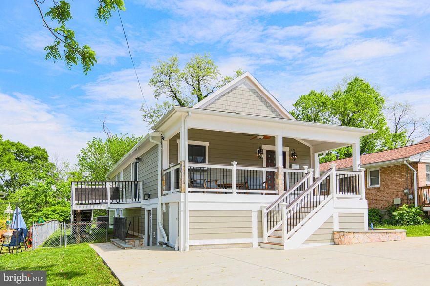 Welcome to 1549 11th St S, a beautifully remodeled residence in the heart of Arlington, VA. This exquisite 3 bedroom, 3 bathroom property offers a harmonious blend of modern amenities and classic charm, making it an ideal choice for discerning buyers seeking convenience and comfort.

Situated just minutes from the Pentagon, Pentagon City, Crystal City, and downtown DC, this home provides unparalleled access to a wealth of shopping, dining, and entertainment options. With a spacious 2091 square feet of living space, this property is designed to accommodate a variety of lifestyles.

The main level features an open concept living space and solid maple floors throughout. The spacious kitchen boasts a mosaic tile backsplash and stainless steel appliances, seamlessly connecting to the dining and living areas. The living room has been thoughtfully designed to incorporate custom built-in storage and display space. Also on the main level are two updated full baths as well as three well-appointed bedrooms. Each bedroom offers ample space and natural light, including a large primary suite with a luxurious en-suite bathroom with a walk-in shower and double vanity. 

The lower level is home to a renovated full bathroom and gorgeous family room with an adjacent kitchenette/full bar equipped with granite counters, travertine flooring, a beverage refrigerator, dishwasher, and ice maker, adding a touch of luxury and convenience for entertaining and guests. A large utility room presents an opportunity to create a legal fourth bedroom while maintaining generous storage options. 

Outdoor living is a highlight of this property. The front porch, equipped with a heater, provides a cozy space for enjoying the outdoors on cooler days. A pass-through window into the kitchen adds convenience, while moisture-proof storage under the porch is perfect for outdoor equipment. The main bedroom offers direct access to the home's rear deck with a built-in hot tub, perfect for relaxation. A paver path leads to a fire pit, creating an inviting atmosphere for gatherings. A second deck on the side of the house off the dining area expands the outdoor living area, ideal for hosting or unwinding.

Parking is a breeze with a private parking pad at the front of the house, accommodating two to three larger vehicles or up to four compact cars. Radiant heat flooring in the main level bathrooms ensures comfort during cooler months. The large attic, accessible via pull-down stairs, provides additional storage space, enhancing the home's functionality.

Notable updates include an architectural shingle roof (2013), Trex decking on the front porch and rear deck (2014), a tankless hot water heater (2015), new plumbing lines throughout (2015), new AC compressor (2019), Hardi plank siding (2021), and much more. (A full list is available upon request.)

This property is a rare find in Arlington, offering a unique combination of location, amenities, and space. Whether you are looking for a family home or a place to entertain, 1549 11th St S delivers on all fronts. Don't miss the opportunity to make this exceptional residence your own. Contact us today to schedule a viewing and experience the lifestyle this home has to offer.