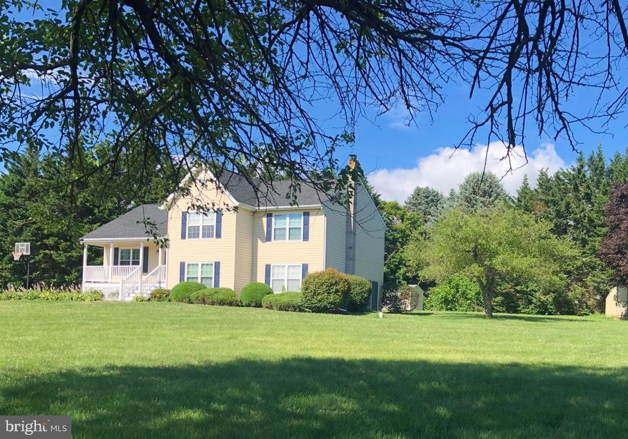 Situated on nearly an acre of private, wooded land, this 2,916-square-foot split-level home balances a traditional layout with a significant list of recent high-end upgrades. The main level connects the kitchen—featuring a new refrigerator (2025) and a casual eat-in area—to a spacious family room anchored by a classic fireplace. Large windows throughout the home frame views of the surrounding timber, providing abundant natural light to the living spaces, which feature brand-new carpet throughout and polished hardwood floors. The primary suite and upper-level bathrooms have been updated with new toilets, while the fully finished walk-out lower level provides a versatile footprint for a home office or recreation room. Beyond the cosmetic updates, the home’s infrastructure has been meticulously maintained for long-term peace of mind, including a recently installed 50-year architectural shingle roof, a new water softener (2024), and a new well pump (2023). This property offers the privacy of a large, wooded lot combined with the reliability of modern, updated systems.