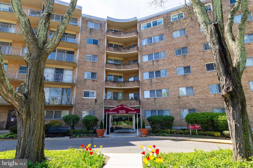 Discover effortless living in this well maintained condo, in the highly sought-after North Building. Located on the fifth floor, this unit offers the perfect blend of community, comfort and convenience. Ready for your personal touch, this spacious unit boasts an open floor plan and is ready for you to make it your own. Neutral decor provides a host of choices for your own decorating taste. Enter to the bright living/dining area and adjacent kitchen with a huge pantry. Step out to the large balcony overlooking the lovely grounds and pool –the perfect spot to enjoy your morning coffee or unwind after a long day. The primary suite includes a full bath and double closets. An additional bedroom with large closet and built in bookshelves, along with a hall bath complete the unit. Beaver Hill offers a lifestyle of ease and security with full time door staff, on-site management, secure buildings, well maintained common areas, lobbies, and hallways., optional community pool access, a community room available for private events and six guest suites for overnight visitors.  Additional highlights are the spacious storage unit on the lower level, laundry facility two doors down, and close proximity to the elevator. The condo fee includes all utilities (water, electricity, gas, trash, and sewer)!  Located just steps from the historic Jenkintown Train Station, and close to parks, shopping, and restaurants.