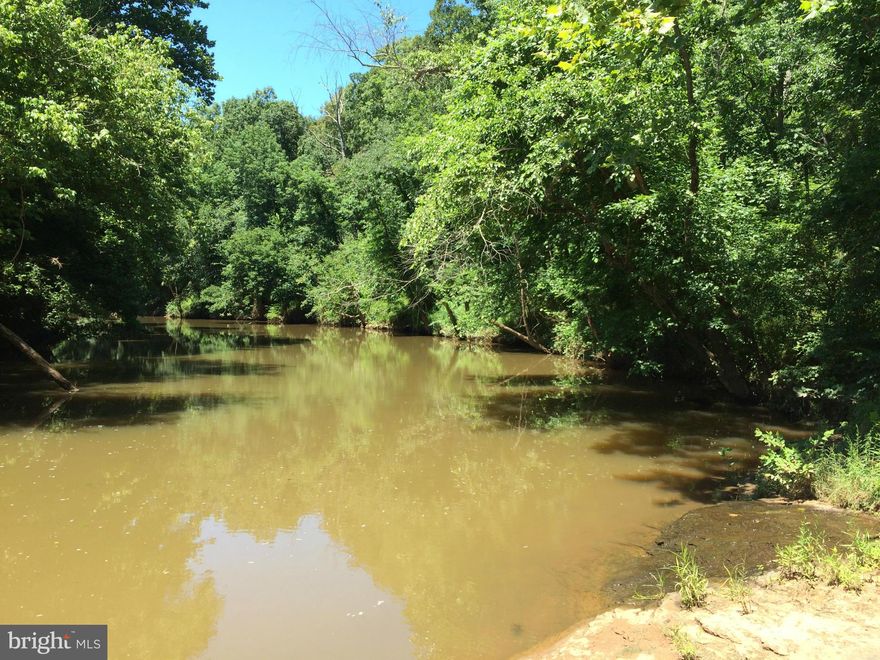 This 2.65 ac parcel is being sold w/two 1/2 ac parcels that adjoin the property.The tax map numbers are 7693-92-3375 & 7693-92-4391 All 3 lots will be sold together.This property has water frontage on Cedar Run which feeds into the Occoquan River and then Lake Jackson. Suitable for 2BR Alt DF. Bristow VA 20136 address. Tax record incorrect.