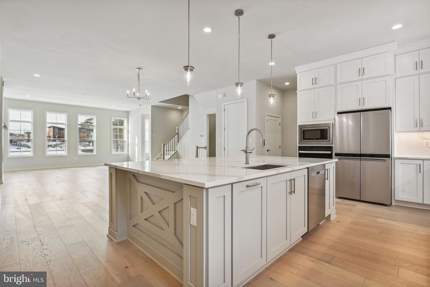 Regency at Belmont – Toll Brothers Newest 55+ active adult community featuring 4 level townhomes with elevators! Complete with top-tier design features in a desirable location, this is the home you've always dreamt of. The white shaker style cabinets stacked to the ceiling enhances the 10 foot ceiling, the silver shaker style cabinets adorn the island which boasts Bianco Calacatta quartz countertops. The open-concept kitchen flows effortlessly into the great room and dining room, making this floor plan ideal for entertaining. Guests will enjoy the serenity and seclusion offered by the first-floor bedroom suite with walk-in shower with seat. The outdoor patio rooftop terrace offers views of Belmont Chase as well as additional dining space that is perfect for social gatherings and an awning for inclement weather. Don't miss another chance on making your dream become reality with this immediate move in home - Call today to schedule an appointment!