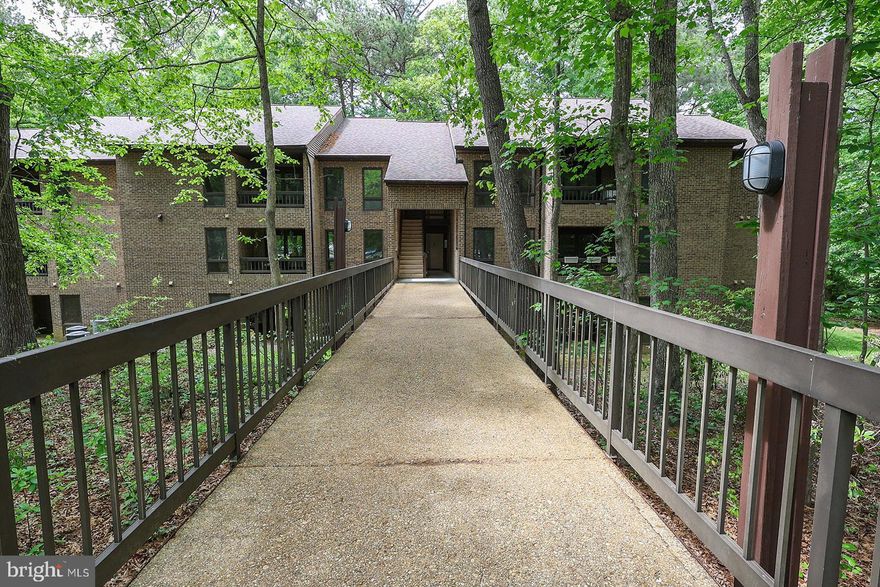 Ground (lower) level condo in convenient Wildewood Community with access to pool and clubhouse that comes with a one year home warranty! UNIT NUMBER ON DOOR IS #826. Condo dues are $275/mo and include trash and water utilities. The assigned parking is close to the condo and guest parking spots are also nearby. Move in ready with  2 Bedrooms and 1.5 bathrooms. The primary bedroom has a WIC w/ attached half bath. The balcony backs to woods and offers a nice space to sit outside. Great investment property or first time home buyer opportunity!