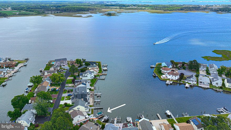 MOTIVATED SELLER!!!   Bring on your offer now before its too late!!   Super easy access out to the ST Martins River from this incredibly spacious waterfront Home  in Teal Bay/Ocean Pines!   Located on wide canal basin, that opens to St. Martins River and allows  for incredible views & sunsets!!   One look will do with this home... custom built with 3 Levels  and plenty of  recent updates.  Various  updates to include: Roof, Siding, flashing and gutters in 2019. New Garage door installed. Kitchen and primary bath updates.  2020  new 7000lb. Boat Lift & new rear awning over spacious deck with lights/sensors to close automatically if needed.  Your Guests can enjoy  the covered lower level outdoor space too!   1st level has Bonus Flex room currently used as office/could be 4th bedroom w/half bath. This area has 2 AC window units and EBB for heat.    10 x 10 Workshop & loads of additional storage space. (Garage is not currently used for parking car/it is storage) . There is a 4000 watt Gas powered portable generator that will convey too!!      2nd level open living/dining  Lovely open great room with  wood burning Fireplace & newer Pella sliders/storm door.  Primary BR is on the 2nd level.  3rd Level  contains 2 additional Bedrooms and a jack/jill Bathroom for guests.  So much storage and great outdoor living space!!