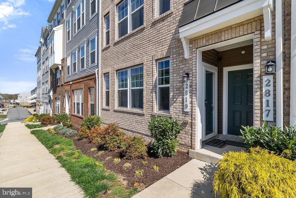 Welcome home! This stunning contemporary townhouse styler condo, built less than 10 years ago, offers a perfect blend of modern design and comfortable living. With 2,700 square feet of thoughtfully designed space, this residence features three spacious bedrooms and two and a half bathrooms, providing ample room for relaxation and entertaining. As you step inside, you'll be greeted by an inviting atmosphere that makes you feel right at home. The open layout is perfect for gatherings, while the well-appointed kitchen is a chef's delight, outfitted with stainless appliances and an oversized kitchen island. The main level is finished off with a designated dining space and a half bath for added convenience. Upstairs, and ensuite offers the perfect escape while two more bedrooms finish off the level accompanied by their own hall bathroom. Enjoy the convenience of an attached garage with rear entry ensuring parking is never a hassle. Located in a vibrant newly built community, this property is just a stone's throw away from public transportation options, including bus stops and the Landover metro station, making commuting a breeze. The surrounding area offers plenty of recreational opportunities to explore. Don’t miss your chance to make this beautiful townhouse your new home! One year of private security system included!