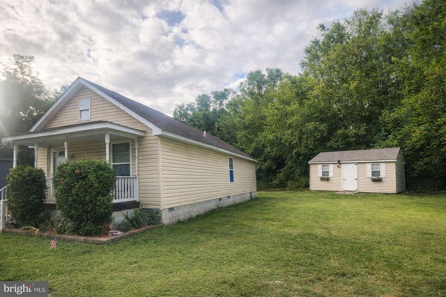 Welcome to this affordable and cozy 3-bedroom, 2-bath rancher, ideally located just three blocks from downtown Cambridge’s restaurants, shops, and Art Center. Updated and remodeled in 2019, this home offers comfortable one-level living with an open, inviting layout. The living and dining areas are well-suited for everyday living and entertaining.

The primary bedroom includes a private full bath, while two additional bedrooms share a hall bath. A dedicated mudroom/laundry area adds everyday convenience, and LED lighting throughout enhances energy efficiency.

Situated on a large double lot, the property provides ample outdoor space and includes a 12' x 20' shed with rough-in electric, ideal for storage, hobbies, or a workshop. Energy-efficient leased solar panels (approximately $150/month) help keep average electric costs under $10 per month, offering excellent long-term savings.

The price reflects the need for new carpet and a cracked vanity top in the primary bath. Being sold as-is, this home presents a great opportunity and value in a desirable Cambridge location. Buyer must qualify for and assume the solar panel lease through Sonova; $100 buyer transfer fee applies.