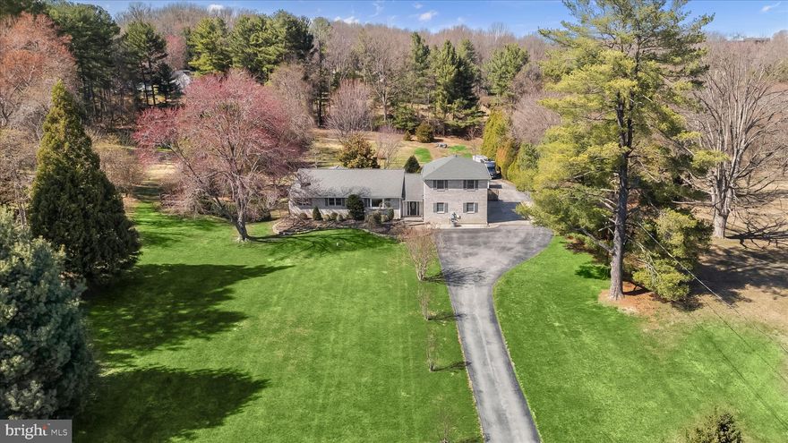 Welcome to this beautifully remodeled home, thoughtfully expanded in 2020 and set on a private 2.07-acre lot backing to nature, located on a no thru street for added privacy and minimal traffic.

A spacious foyer with ceramic tile flooring welcomes you inside and leads seamlessly into the dining area, where hardwood floors, a bay window, and abundant natural light create an inviting setting for everyday living and gatherings. The adjacent family room is anchored by a striking stone wall wood-burning fireplace and enhanced with crown molding, providing a warm and cohesive main living space.

The fully remodeled kitchen is designed with both style and function in mind, featuring granite countertops, a tiled backsplash, under-cabinet lighting, stainless steel appliances, a gas cooktop, and a built-in planning station. A vaulted ceiling and ceiling fan add to the sense of space, while direct access leads to the Azek dining deck, perfect for outdoor entertaining and overlooking the peaceful, tree-lined rear yard.

The main level offers a flexible and highly functional layout, including a primary bedroom with hardwood flooring, vaulted ceiling, and a beautifully updated en-suite bath with a fully retiled walk-in shower. A dedicated study with French doors provides an ideal work-from-home space, while an additional flex room with a half bath and private entrance offers excellent potential for guests, office use, or multi-generational living. A convenient main-level laundry room is equipped with a utility sink and an additional shower for added functionality.

Upstairs, a loft area connects to two additional bedrooms with new carpet, fresh paint and ceiling fan. A full hall bath, creates a comfortable secondary living space.

The lower level features ceramic tile flooring throughout, offering both a recreation area and game space, ideal for entertaining or everyday use.

Outdoor living is complemented by a private rear setting surrounded by mature trees. The property also includes both an attached front-load 2-car garage and a detached garage, providing ample parking, storage, and flexibility.

Located in a desirable Howard County setting, this home offers a balance of privacy and accessibility with nearby parks, shopping, dining, and commuter routes. Enjoy the benefit of a quiet, residential setting while remaining within easy reach of everyday conveniences and major roadways.

Recent updates include fresh interior paint (2026), new carpet (2025), and roof replacements in 2015 and 2020 corresponding with the home’s expansion.