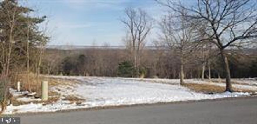 This 2.726 acre lot offers Mountain views, it's located in a quiet cul-de-sac in the very well kept subdivision of Cacapon South. This leisure living community has underground utilities, paved roads, with protective covenants.  Cacapon South is just across from the Cacapon State Park entrance, you'll enjoy the lake and picnic activities,  golfing, hiking, walking trails, swimming and dining. HOA Fees: $300.00 regular HOA, $200 special assessment both collected annually $395.52 Sewer fee collected