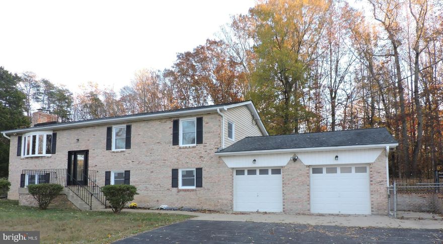 WOW!  Completely Remodeled Home Sitting On 5 Acres of Mostly Cleared Land and Largely Fenced Rear.  This Home Will Impress from the Moment You Walk Through the New Front Door with Side Panels.  The 100% Renovated Kitchen with New 42" Cabinets, Stainless Appliances, Quartz Counters with New Sink and New Tile Flooring. It's Simply Gorgeous.   All New Carpet and Paint Through-Out the Home.  New Bathrooms With all New Toilets. Tubs, Vanities/Water Fall Faucets, New Mirrors, New Tile Flooring.  Even Exhaust Fans.  New Windows, All Interior Doors were Replaced with New 6 Panel Doors.  Home Features 2 Fireplaces, New French Doors Will Leed You to a Wonderful Screened Porch with a High Beamed Ceiling.  All of The Light Fixtures, Switches and Plates are New.  There are New Fire-Resistant Doors on the Garage. There are also 2 Large Sheds. Completed Maintenance Include: HCVAC Ducts Cleaned Water Softer Serviced and Filled Repainted Shutters and Foundation. Doorbell and Thermostat Have also Been Replaced. You have Heard It Before, but This Is Truely a Must See....Finished Sqft on lower level are approx..